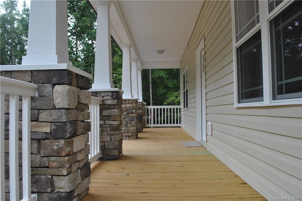 335 Creswell Road, Unit 1011 Mount Gilead, NC 27306 - Photo 5 of 18 a porch with seating space