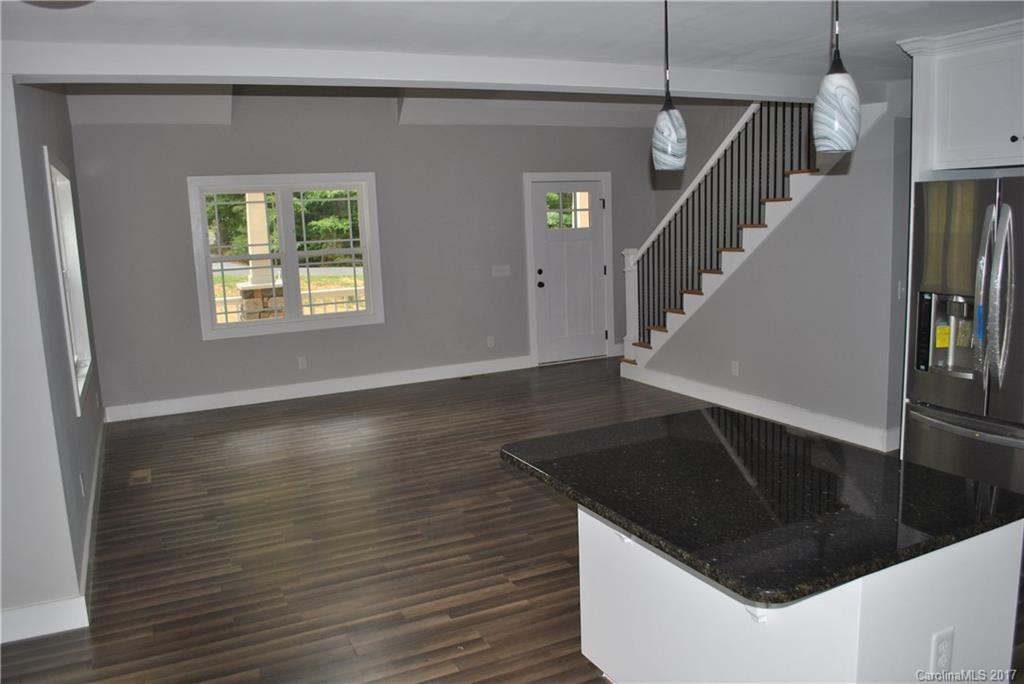 335 Creswell Road, Unit 1011 Mount Gilead, NC 27306 - Photo 6 of 18 a view of entryway and hall with wooden floor