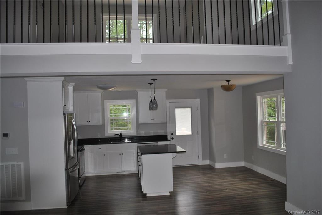 335 Creswell Road, Unit 1011 Mount Gilead, NC 27306 - Photo 9 of 18 a view of a kitchen and window with a sink