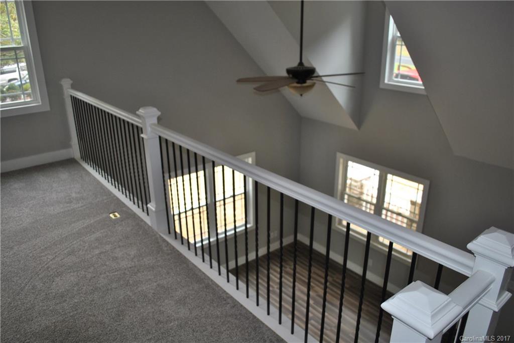 335 Creswell Road, Unit 1011 Mount Gilead, NC 27306 - Photo 10 of 18 a view of staircase with railing and a window
