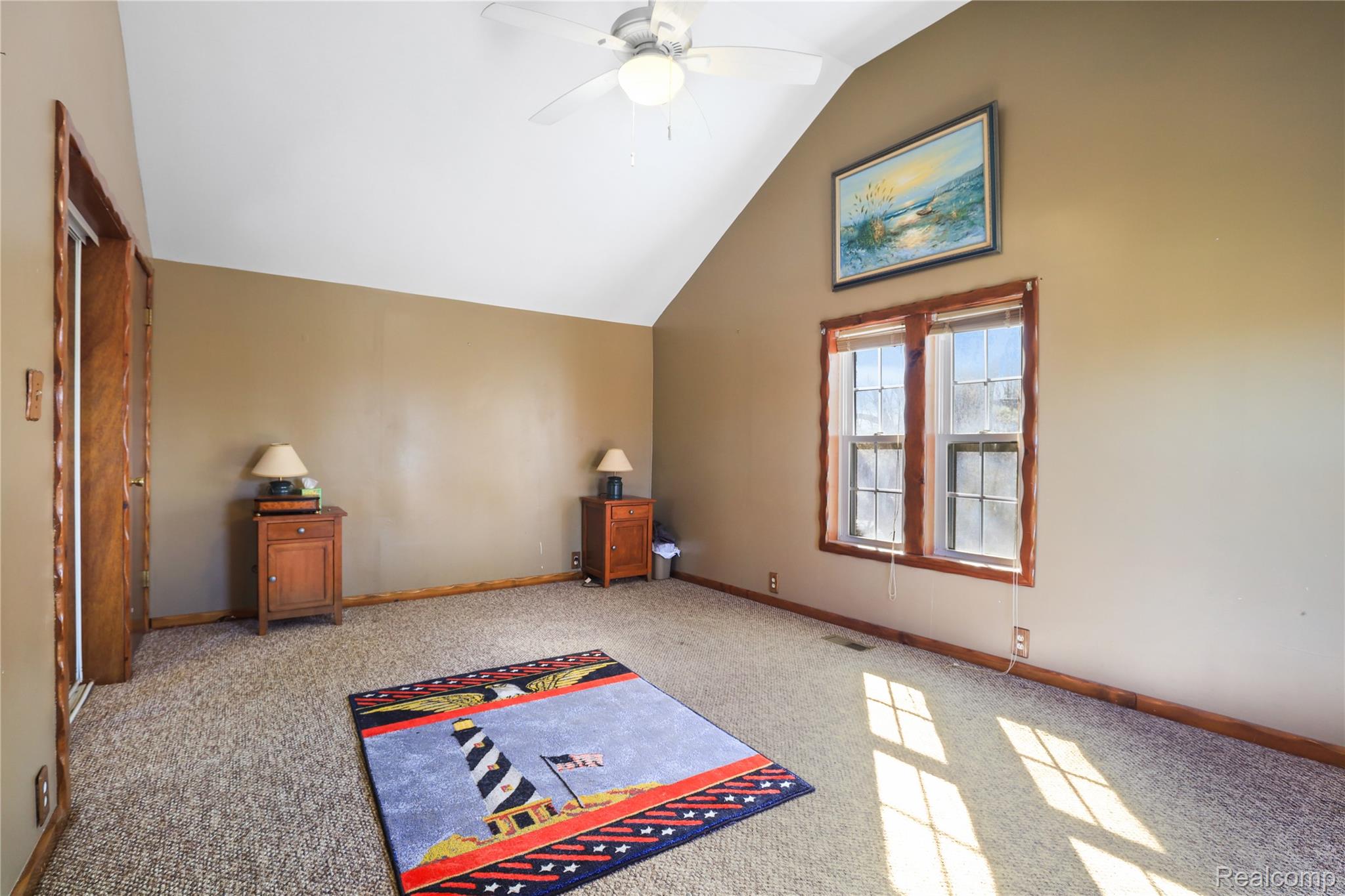 7149-7163 Burpee Road Grand Blanc, MI 48439 - Photo 71 of 72 Bonus room featuring a ceiling fan, vaulted ceiling, and light colored carpet
