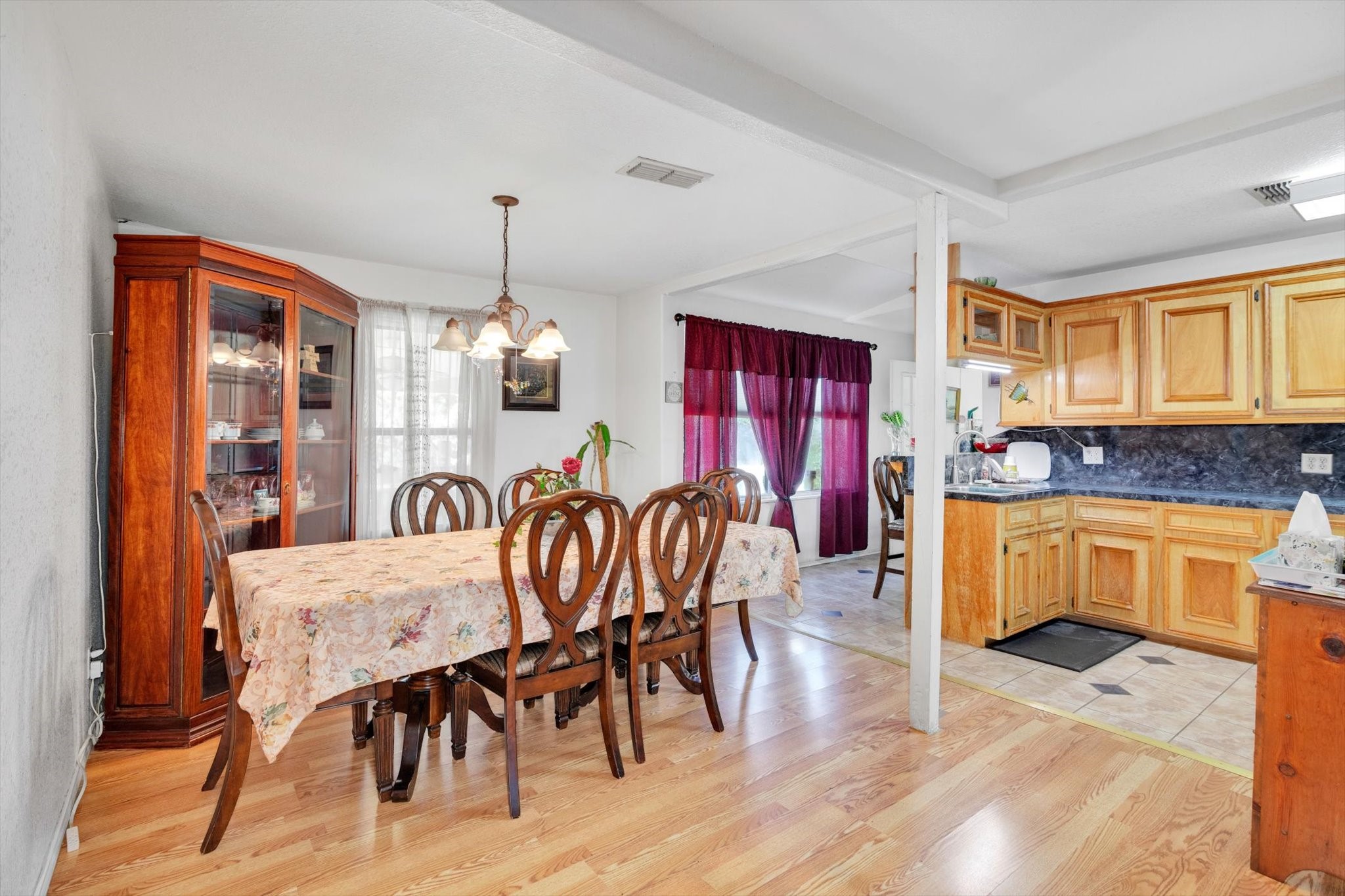 90 County Road 2852 Cleveland, TX 77327 - Photo 12 of 50 a dining room with furniture a chandelier and wooden floor