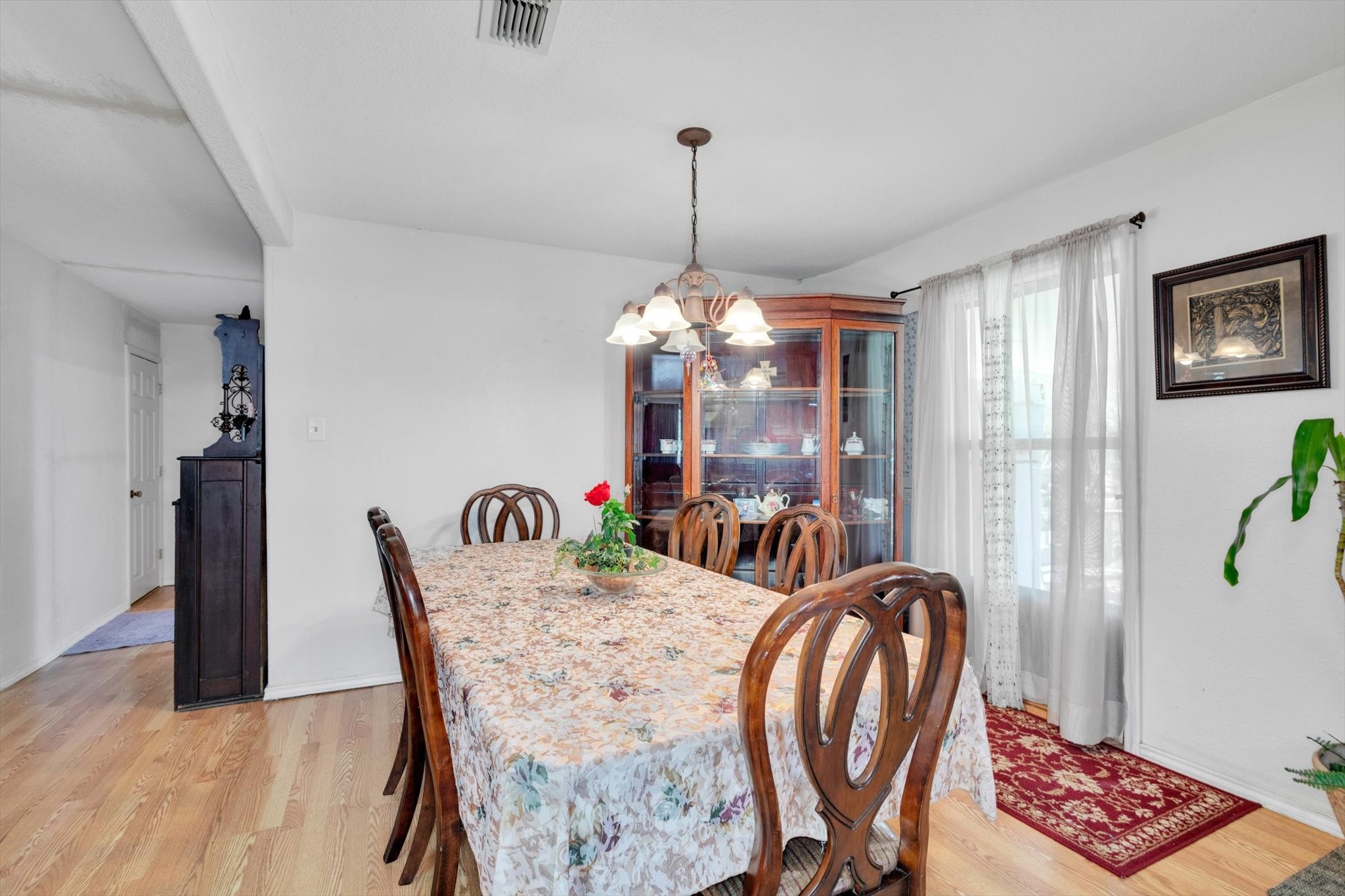 90 County Road 2852 Cleveland, TX 77327 - Photo 15 of 50 a view of a dining room with furniture and chandelier