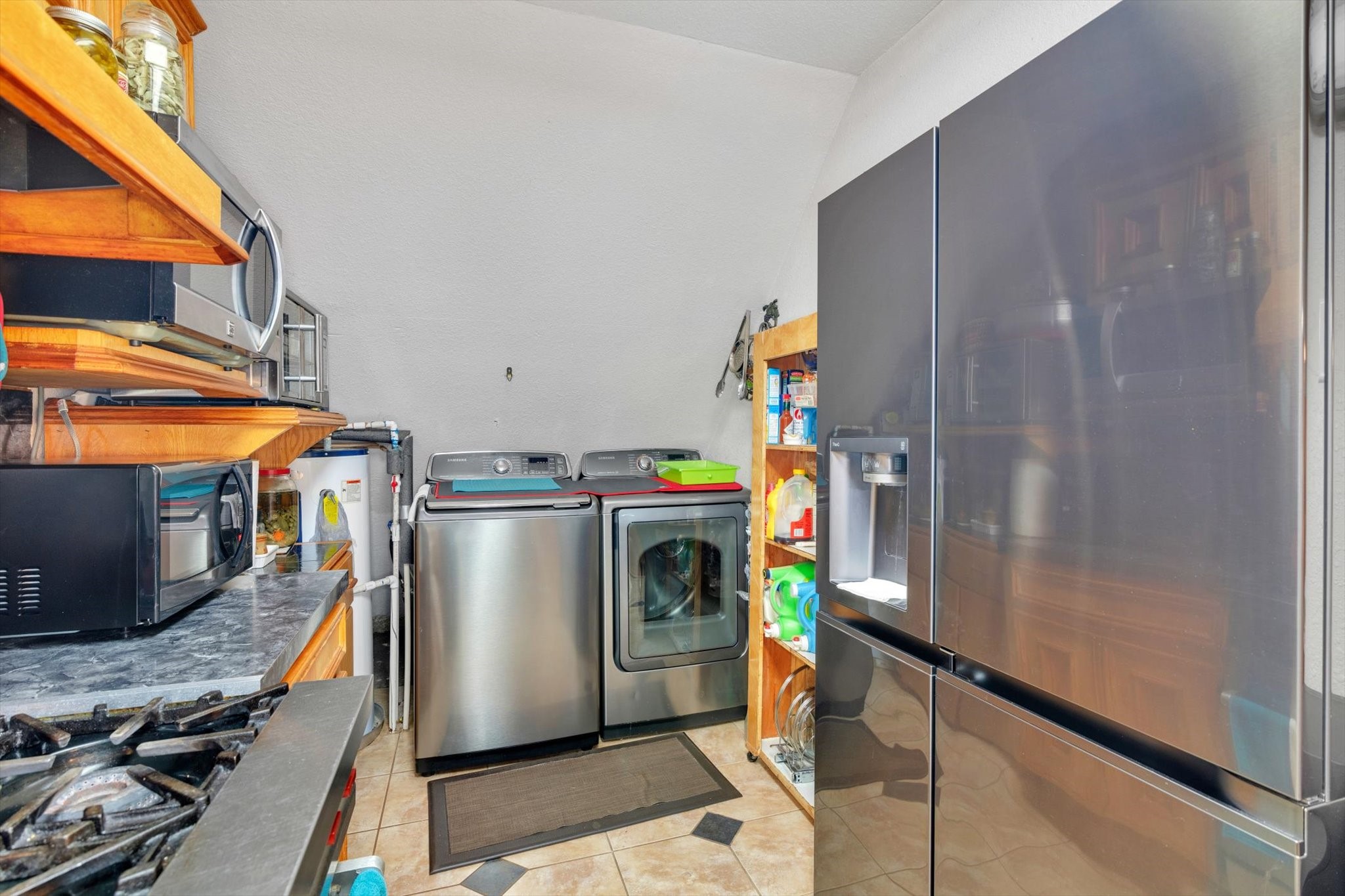 90 County Road 2852 Cleveland, TX 77327 - Photo 18 of 50 a utility room with dryer and washer