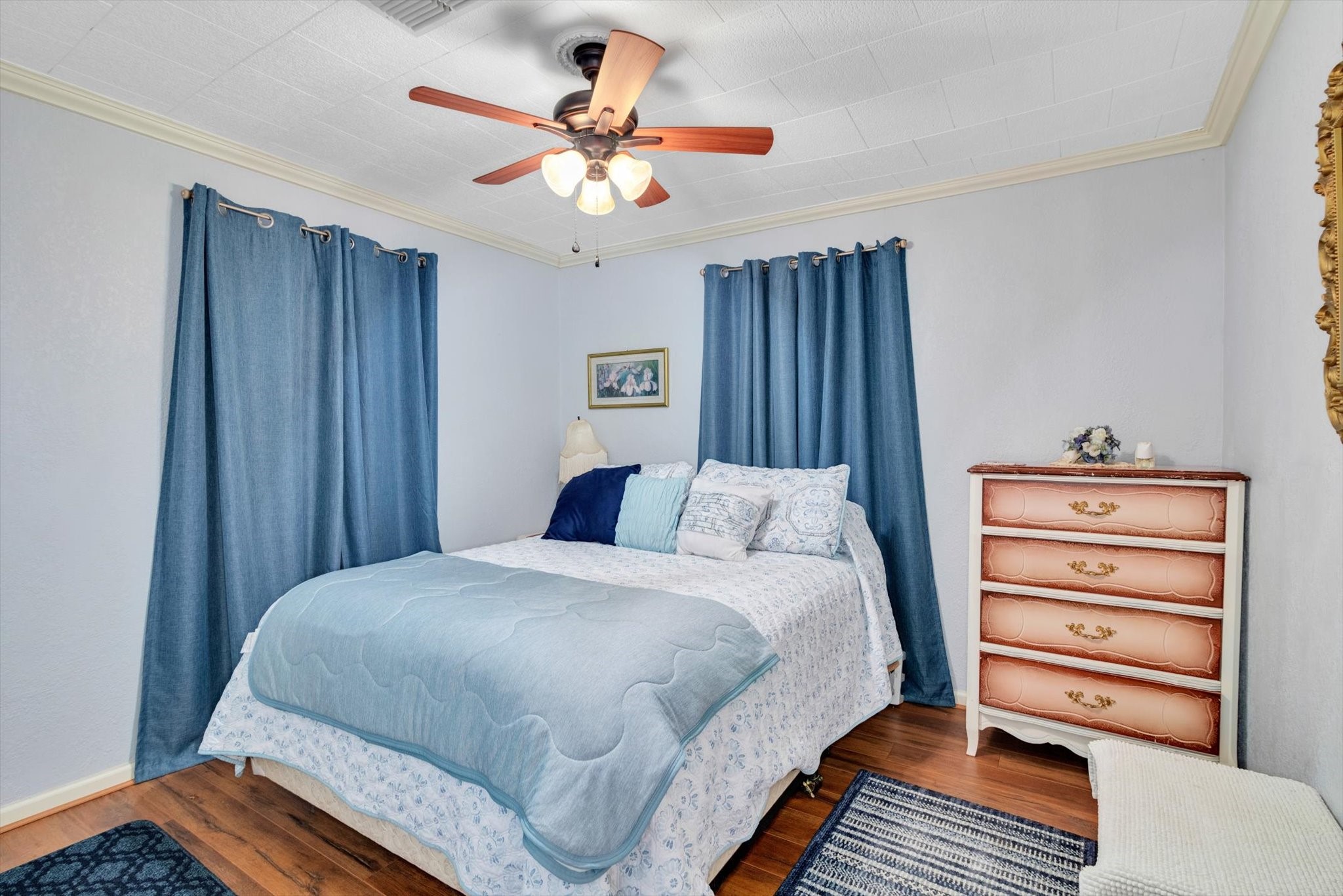 90 County Road 2852 Cleveland, TX 77327 - Photo 19 of 50 a bedroom with a bed and a chandelier