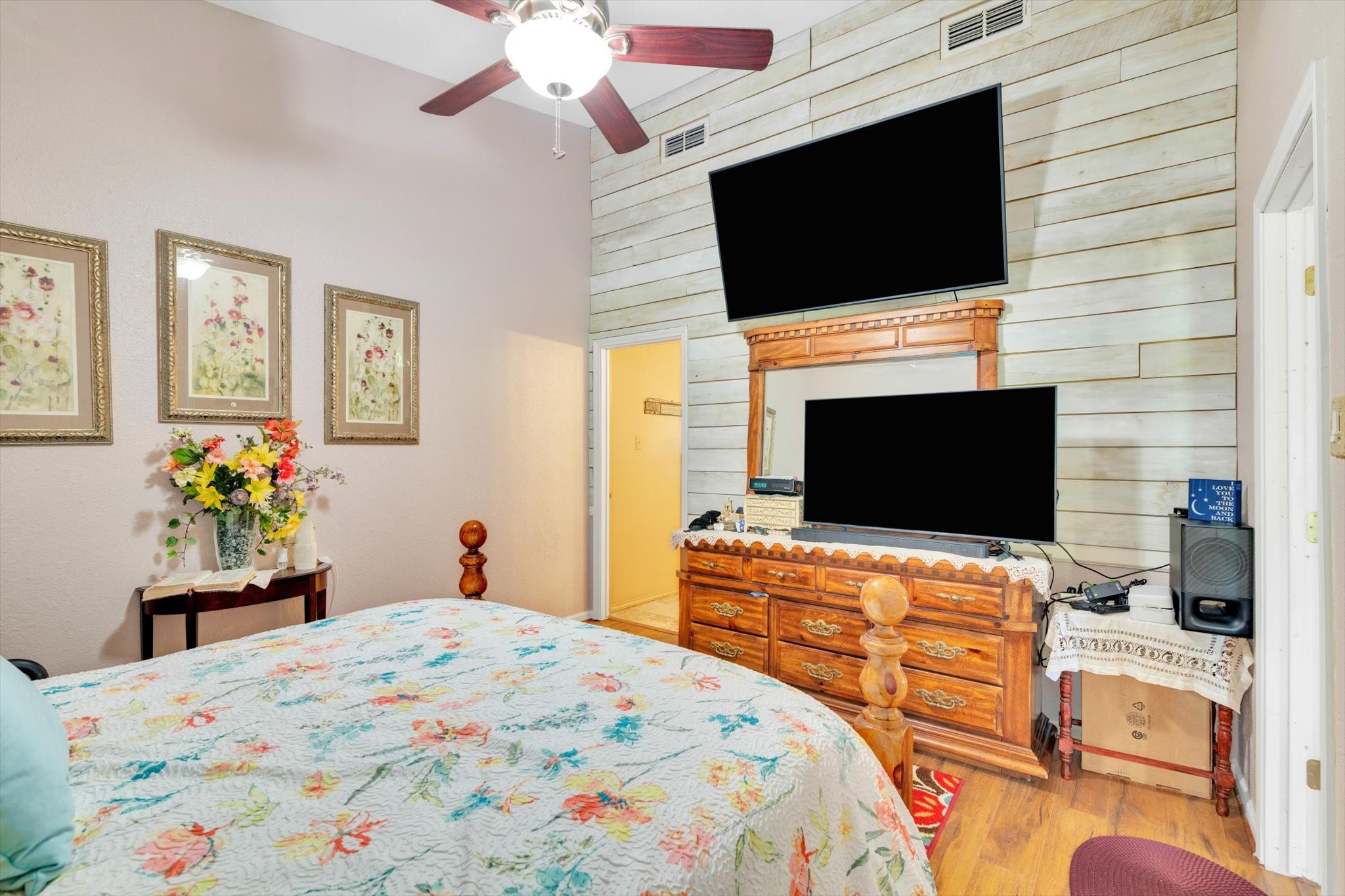 90 County Road 2852 Cleveland, TX 77327 - Photo 23 of 50 a bedroom with a bed and a flat screen tv