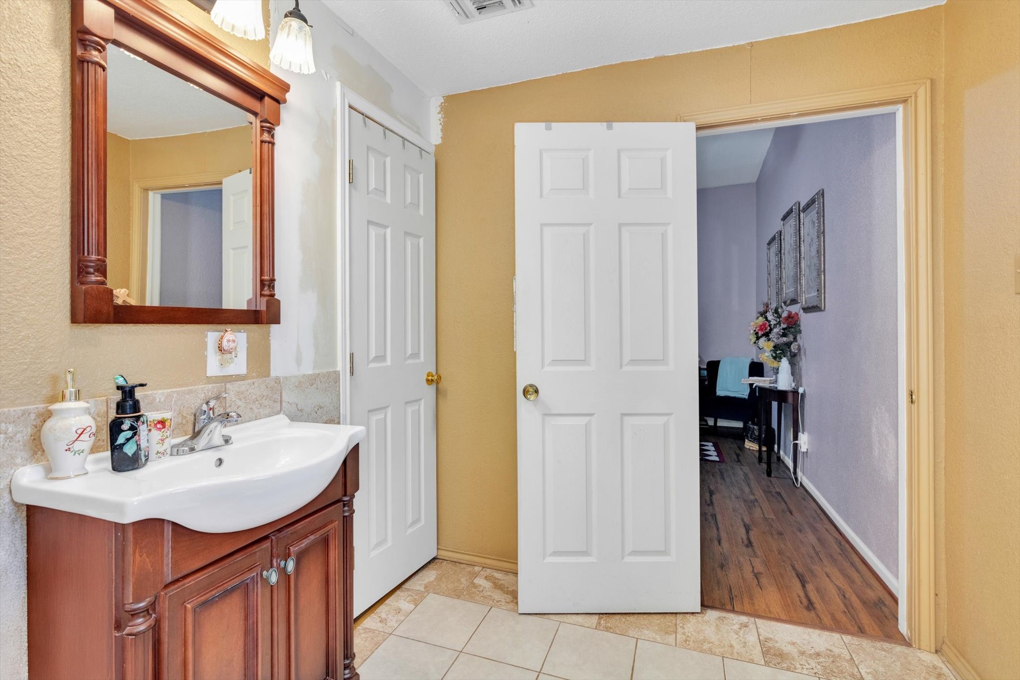 90 County Road 2852 Cleveland, TX 77327 - Photo 26 of 50 a bathroom with a sink and a mirror