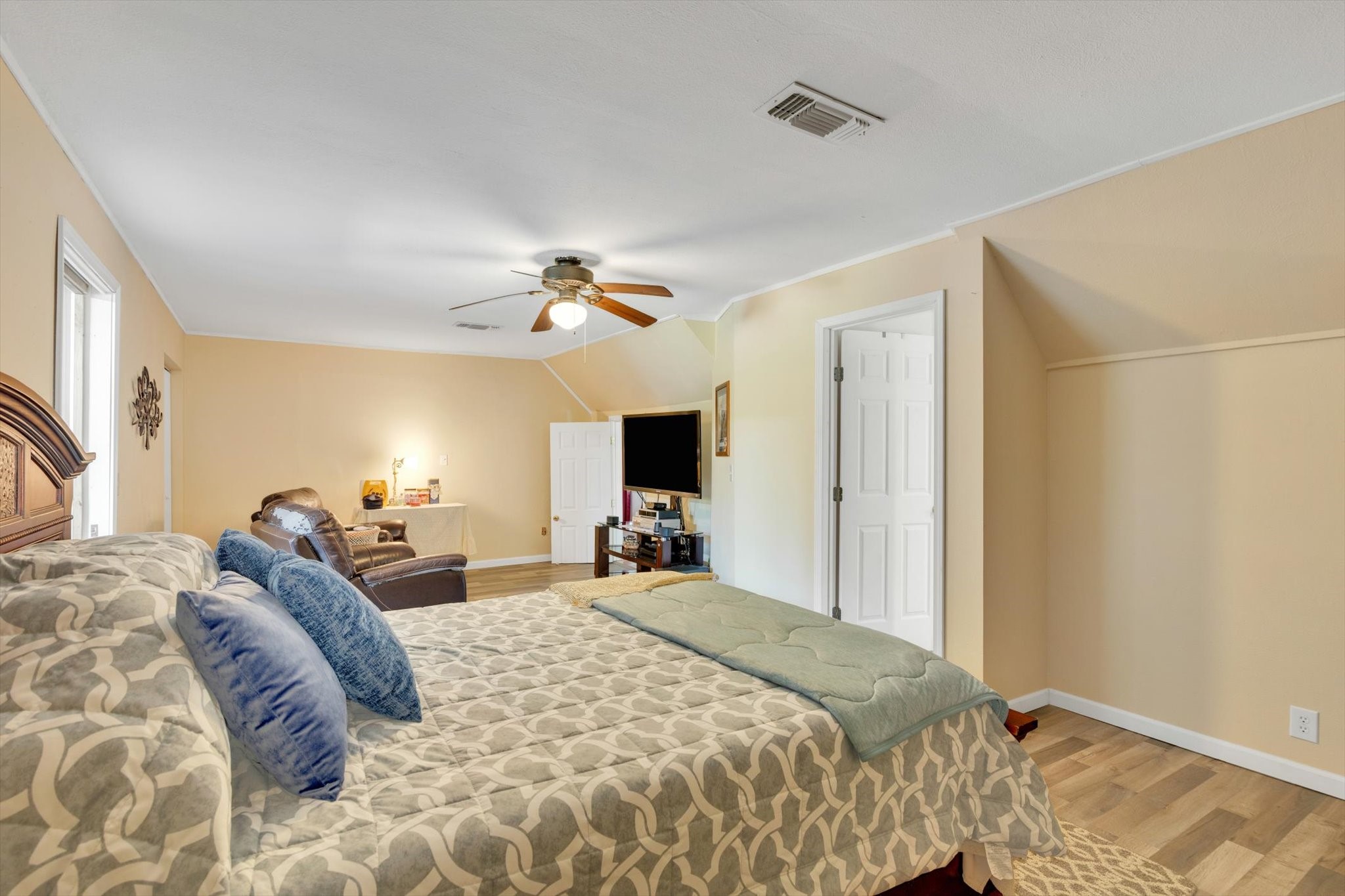 90 County Road 2852 Cleveland, TX 77327 - Photo 29 of 50 a bed room with a bed and a chandelier