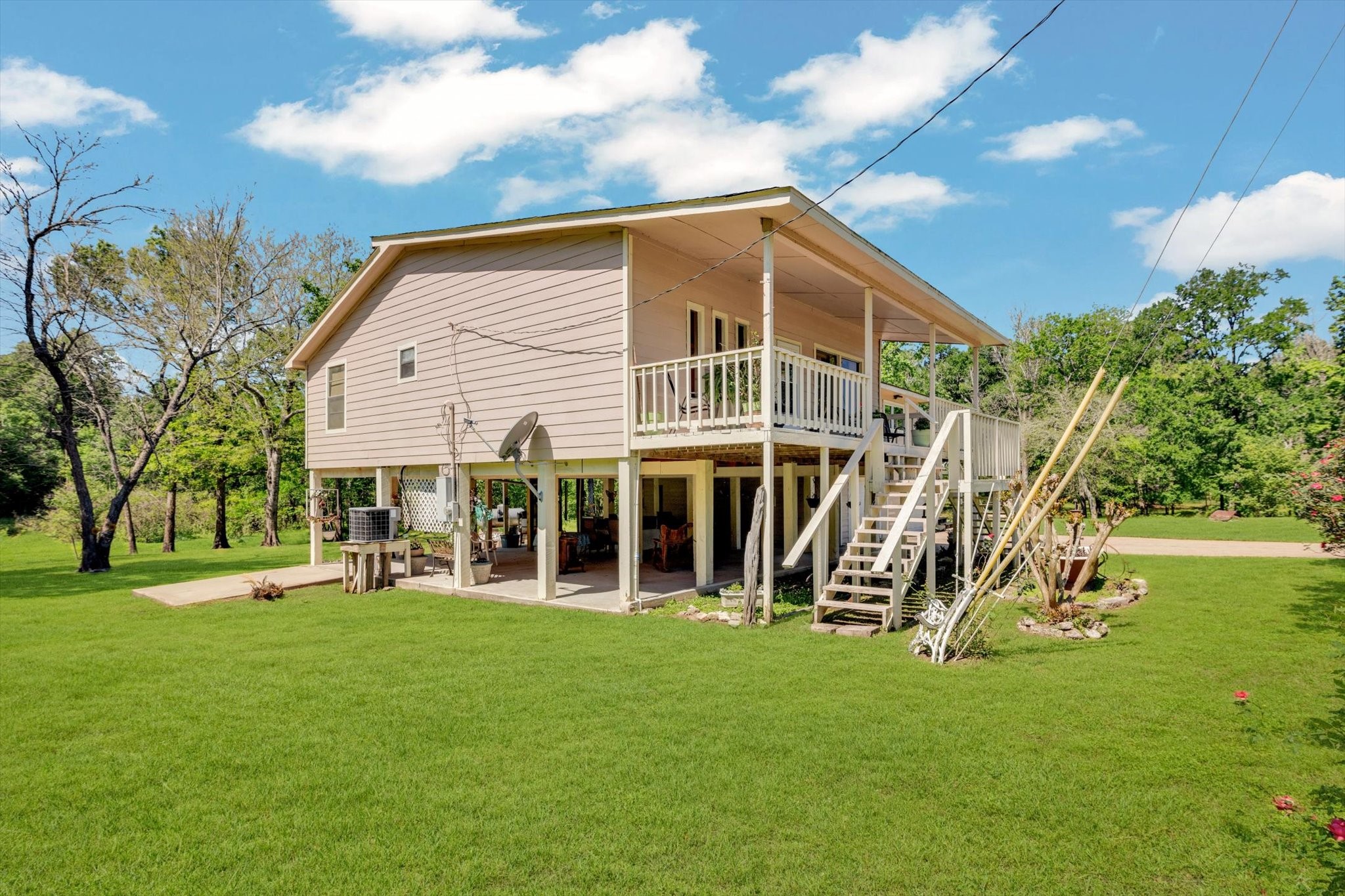 90 County Road 2852 Cleveland, TX 77327 - Photo 4 of 50 a view of a house with a yard