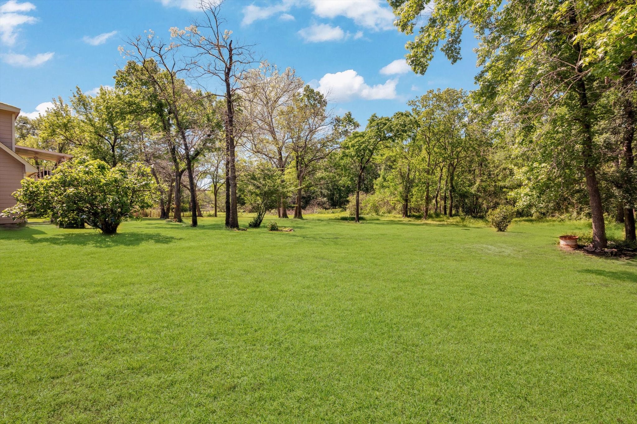 90 County Road 2852 Cleveland, TX 77327 - Photo 44 of 50 a huge green field with lots of trees