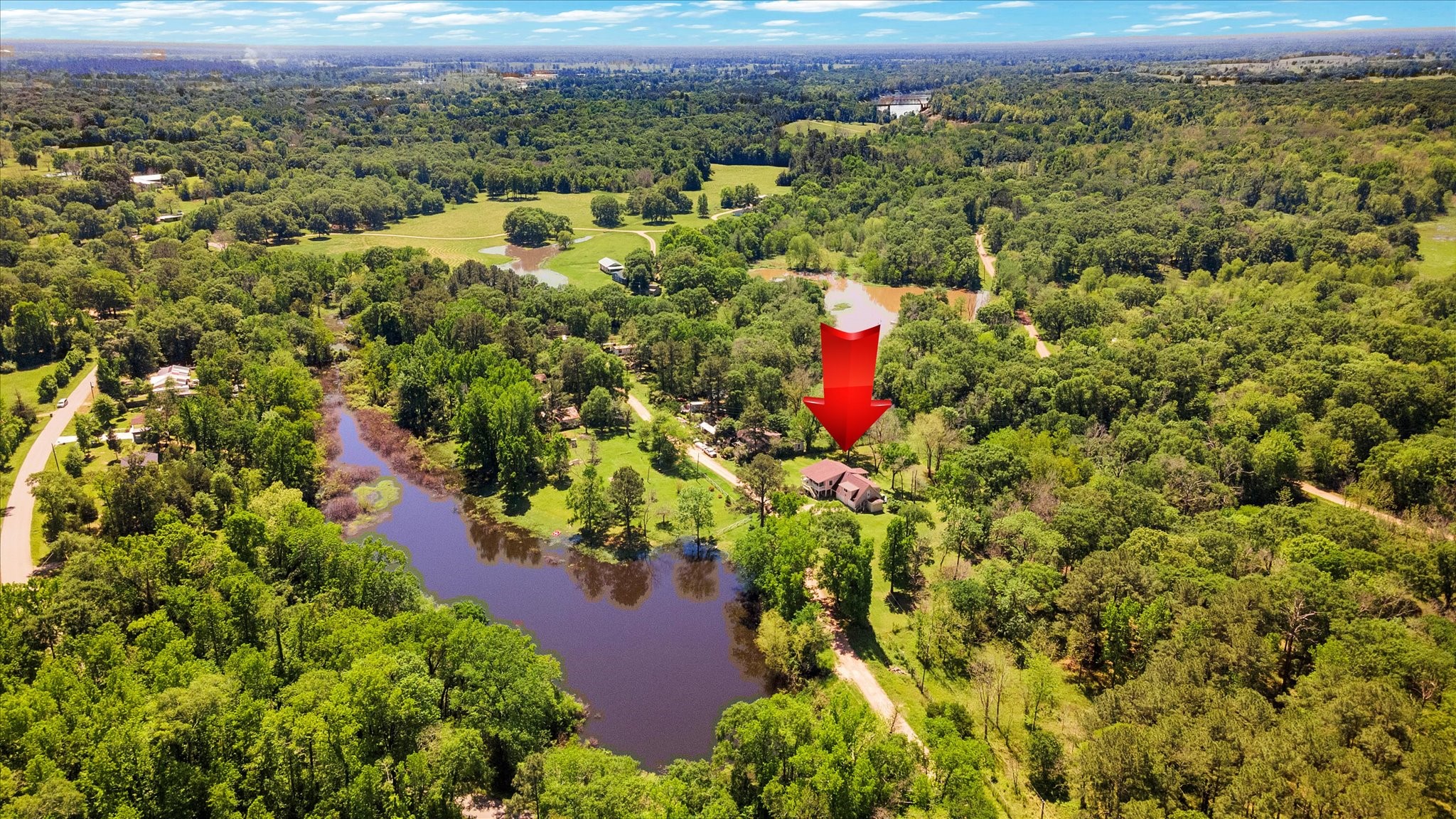 90 County Road 2852 Cleveland, TX 77327 - Photo 50 of 50 an aerial view of a houses with a yard