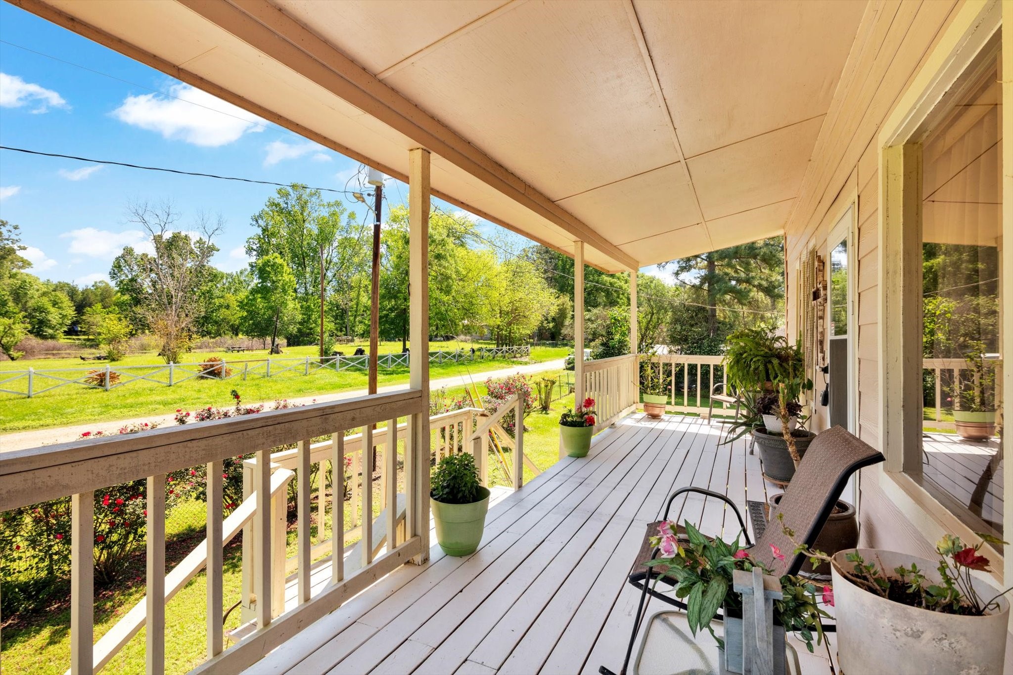 90 County Road 2852 Cleveland, TX 77327 - Photo 6 of 50 a view of balcony with wooden floor