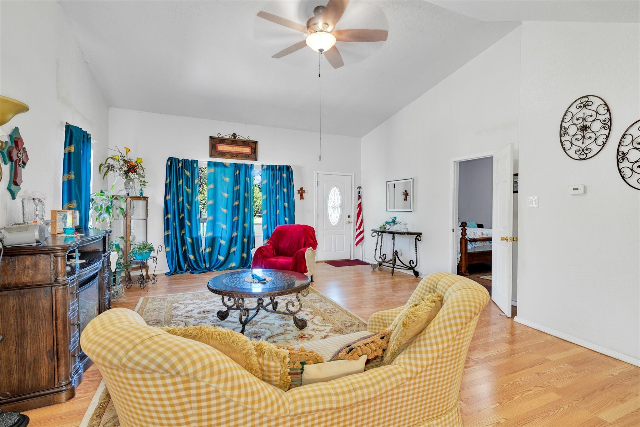 90 County Road 2852 Cleveland, TX 77327 - Photo 9 of 50 a living room with furniture a chandelier and a dining table