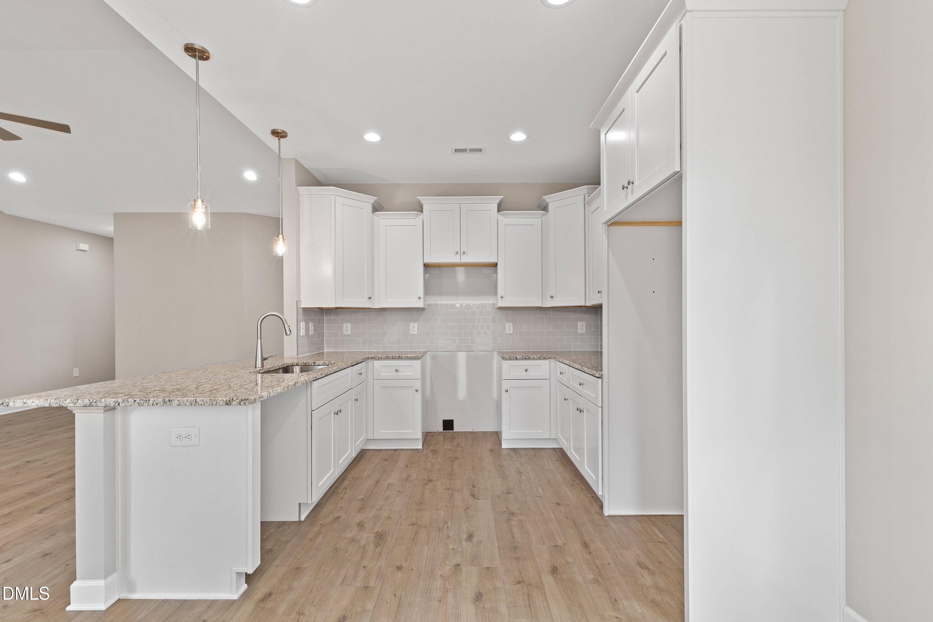 1115 Nor-Am Road Pikeville, NC 27863 - Photo 15 of 40 a large kitchen with a lot of counter space and wooden floor