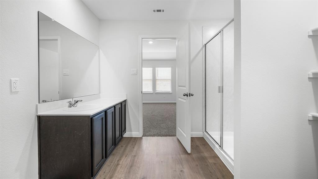 1921 Reveille Way Terrell, TX 75160 - Photo 21 of 30 a bathroom with a sink a toilet and shower