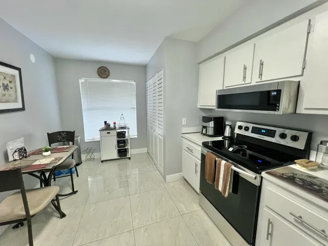 a kitchen with a stove and a microwave