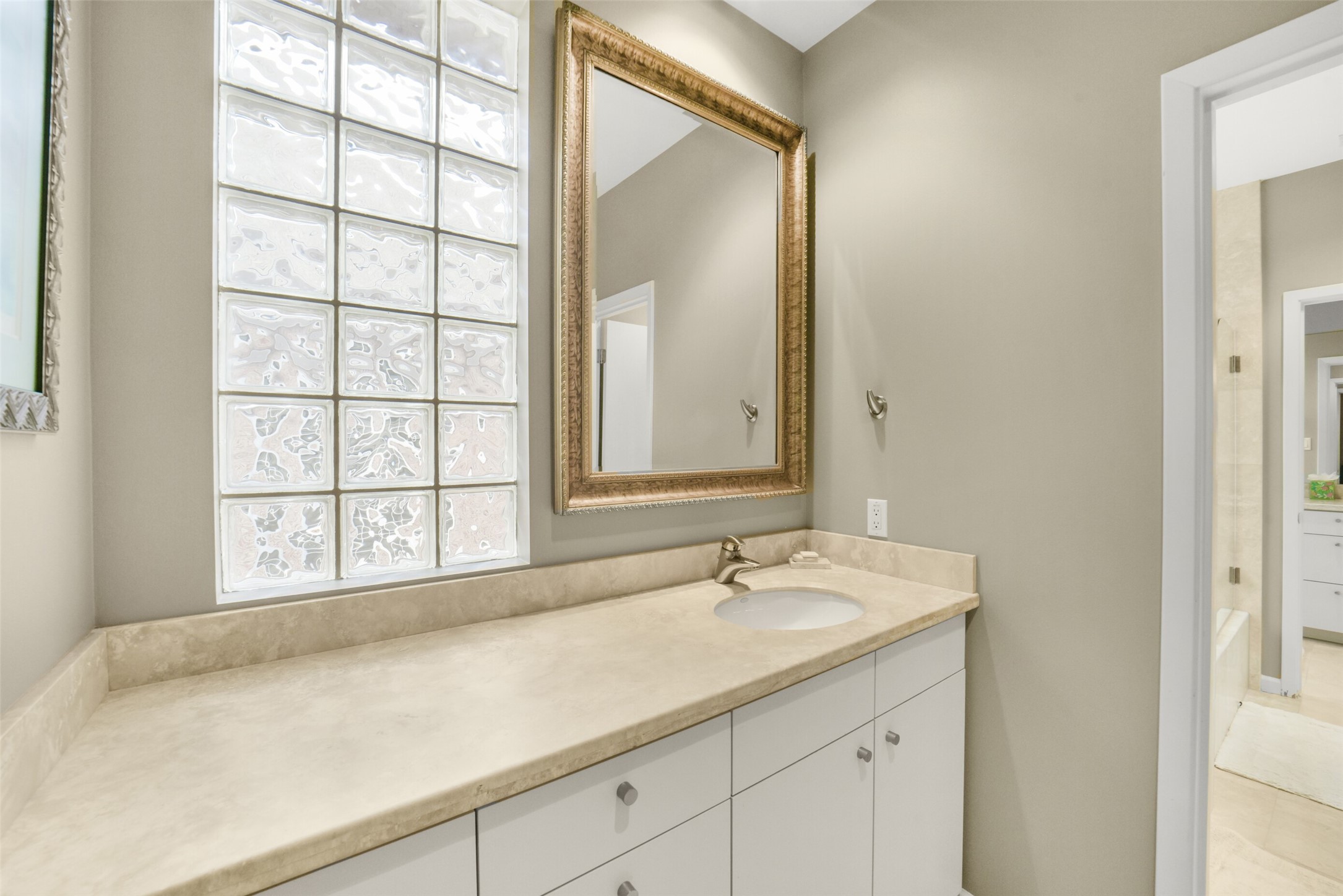 15 Hudson Circle Houston, TX 77024 - Photo 25 of 50 a bathroom with a sink and a mirror