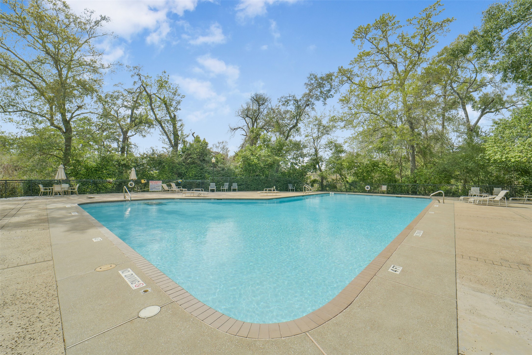 15 Hudson Circle Houston, TX 77024 - Photo 49 of 50 a view of a swimming pool with a yard
