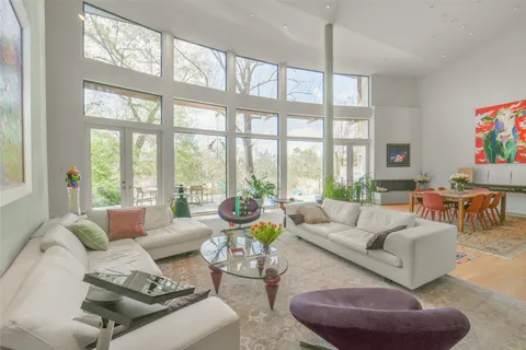 a kitchen with stainless steel appliances granite countertop a sink dishwasher and a stove with wooden floor