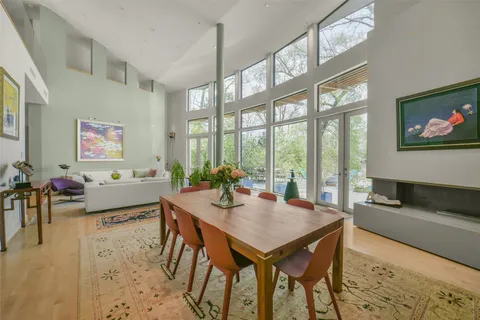 a spacious bathroom with a double vanity sink and a large mirror