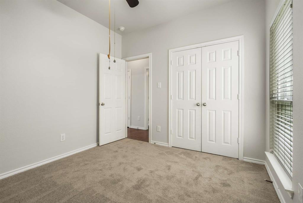 10969 Colonial Heights Lane Fort Worth, TX 76179 - Photo 20 of 34 wooden floor in an empty room with a window