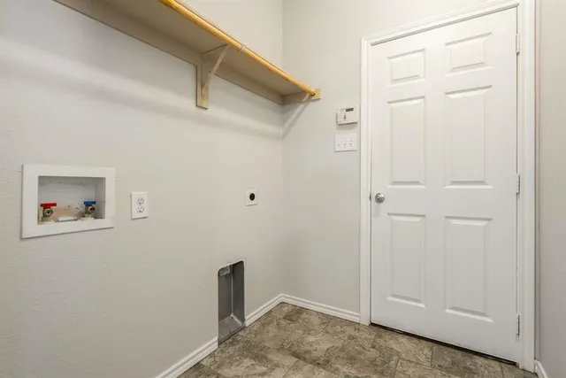 a view of storage and utility room with closet