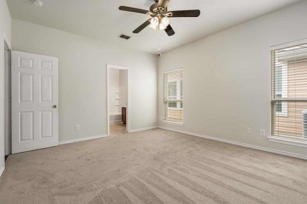 10969 Colonial Heights Lane Fort Worth, TX 76179 - Photo 24 of 34 a view of an empty room with a window