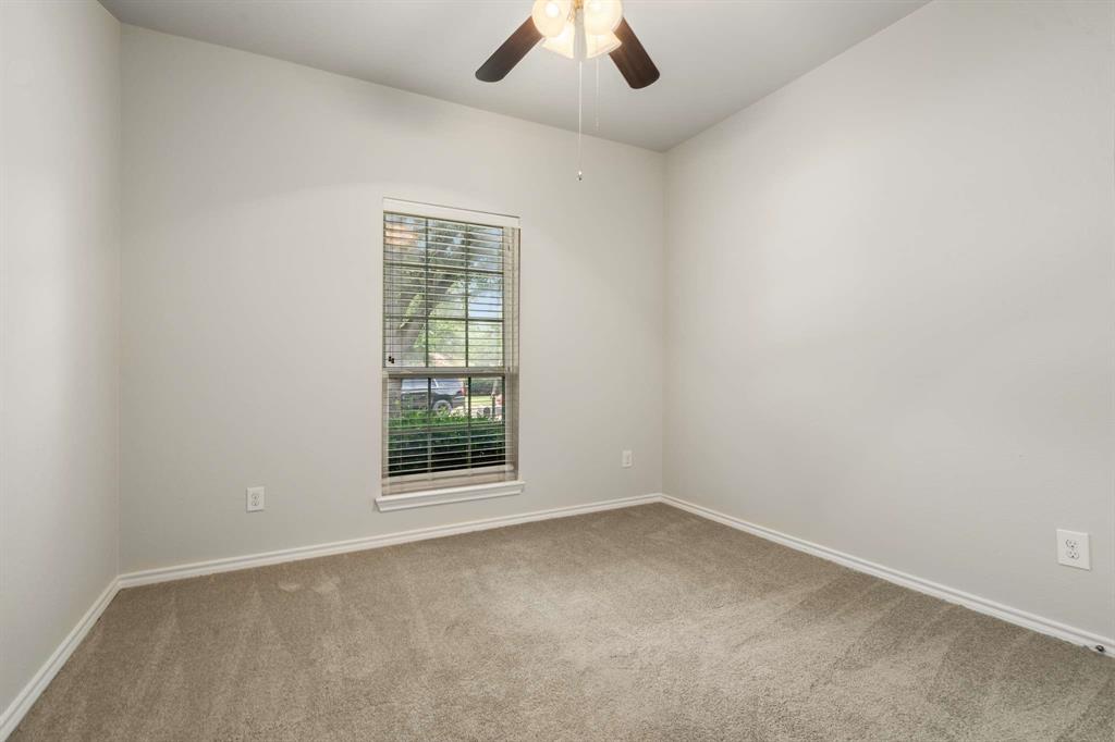 10969 Colonial Heights Lane Fort Worth, TX 76179 - Photo 29 of 34 an empty room with a empty space and a window