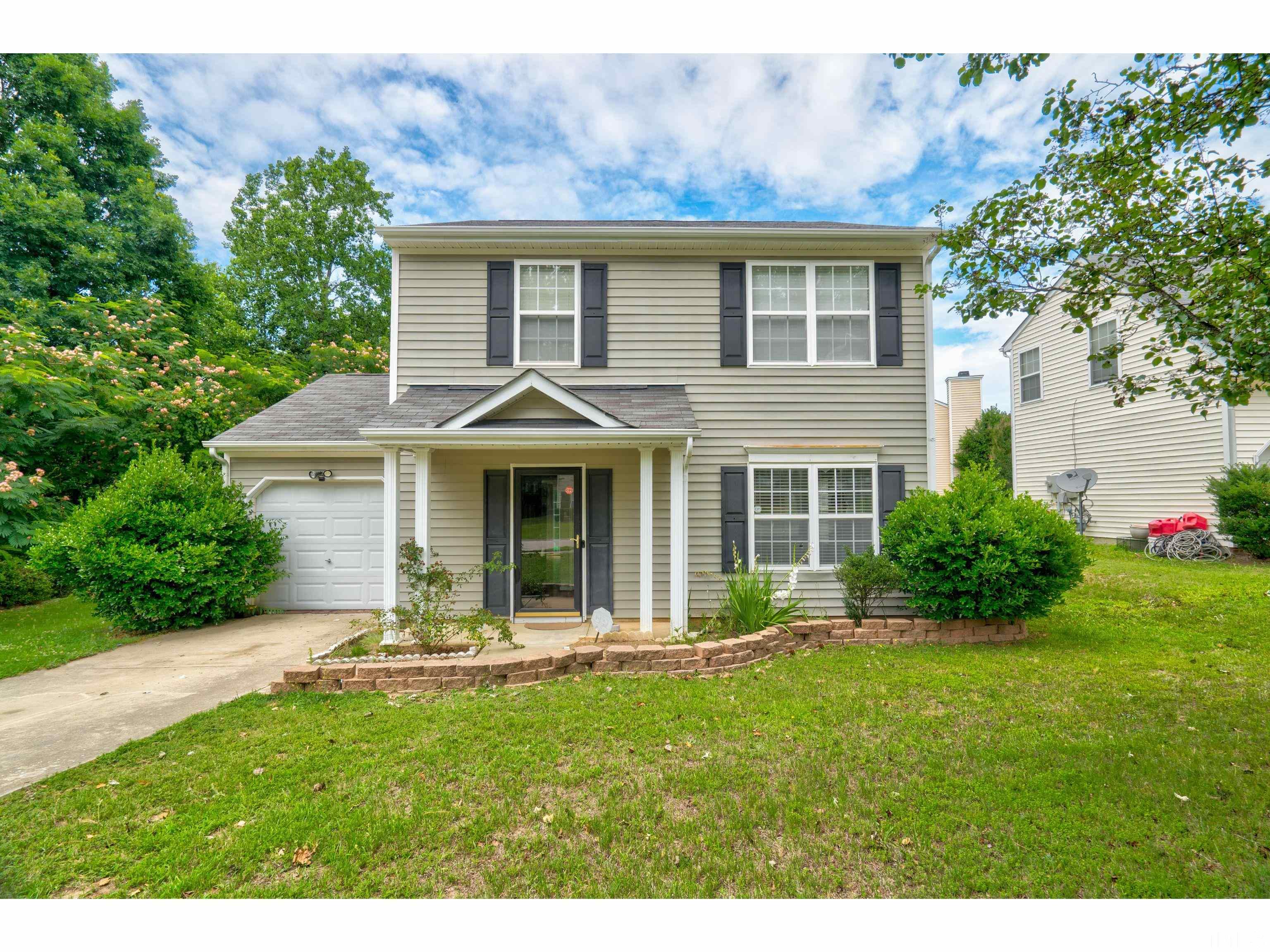 4429 Cobble Creek Lane Raleigh, NC 27616 - Photo 1 of 4 a view of a house with backyard and garden