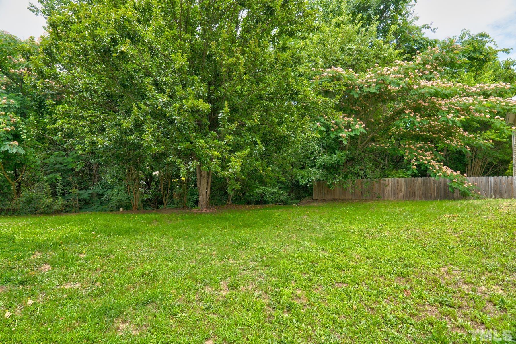 4429 Cobble Creek Lane Raleigh, NC 27616 - Photo 3 of 4 a view of a green yard