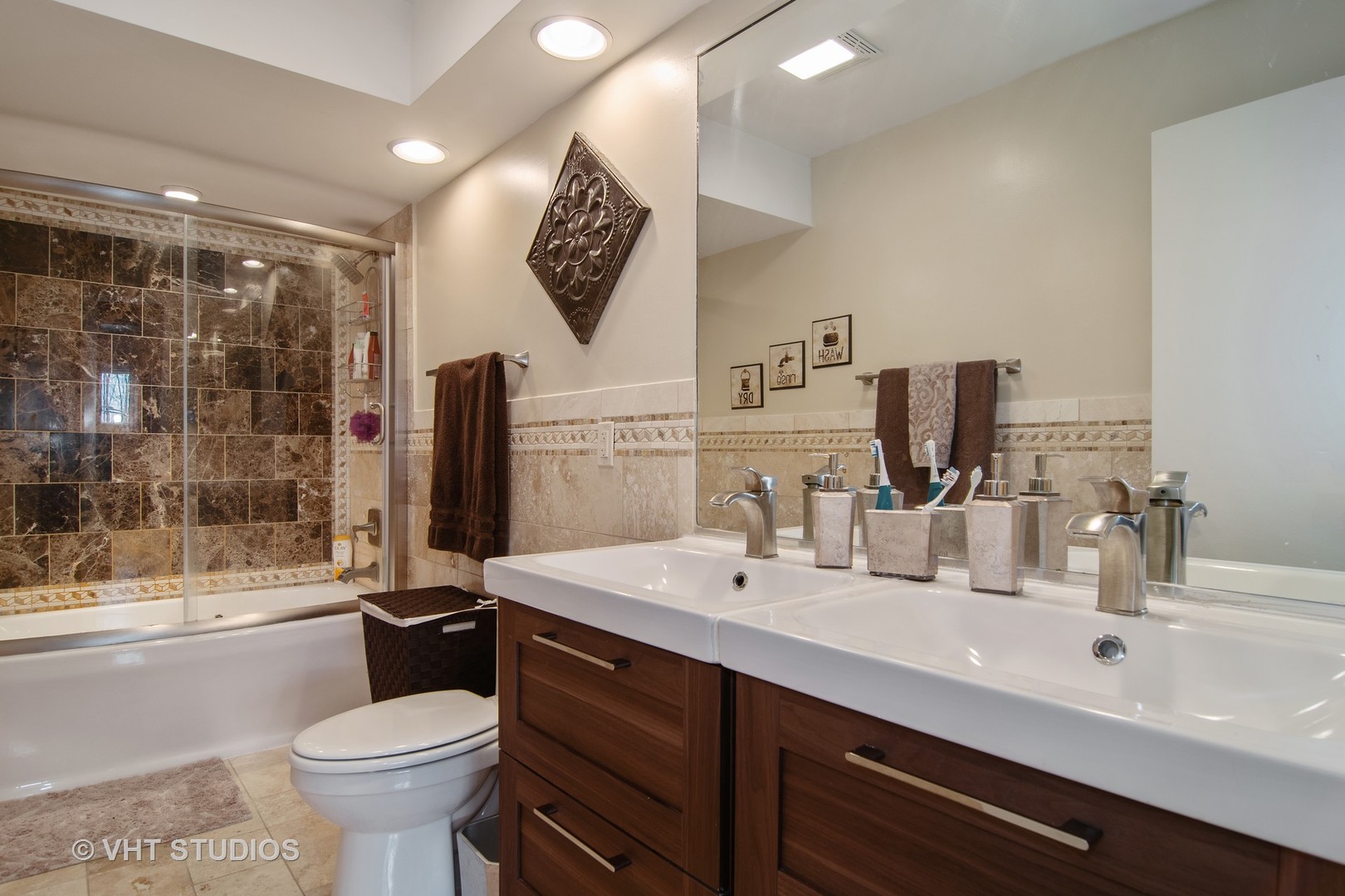27-w084 Jewell Road Winfield, IL 60190 - Photo 10 of 16 a bathroom with a toilet sink and mirror
