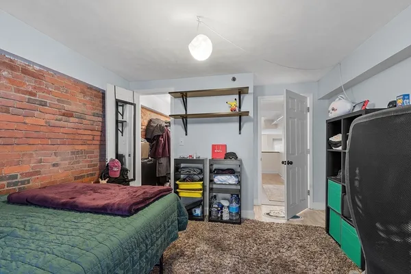 a bed room with a bed and a mirror