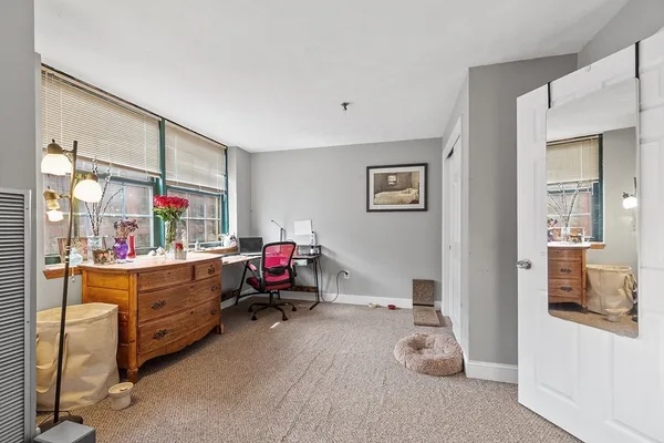 a bathroom with a sink toilet and mirror