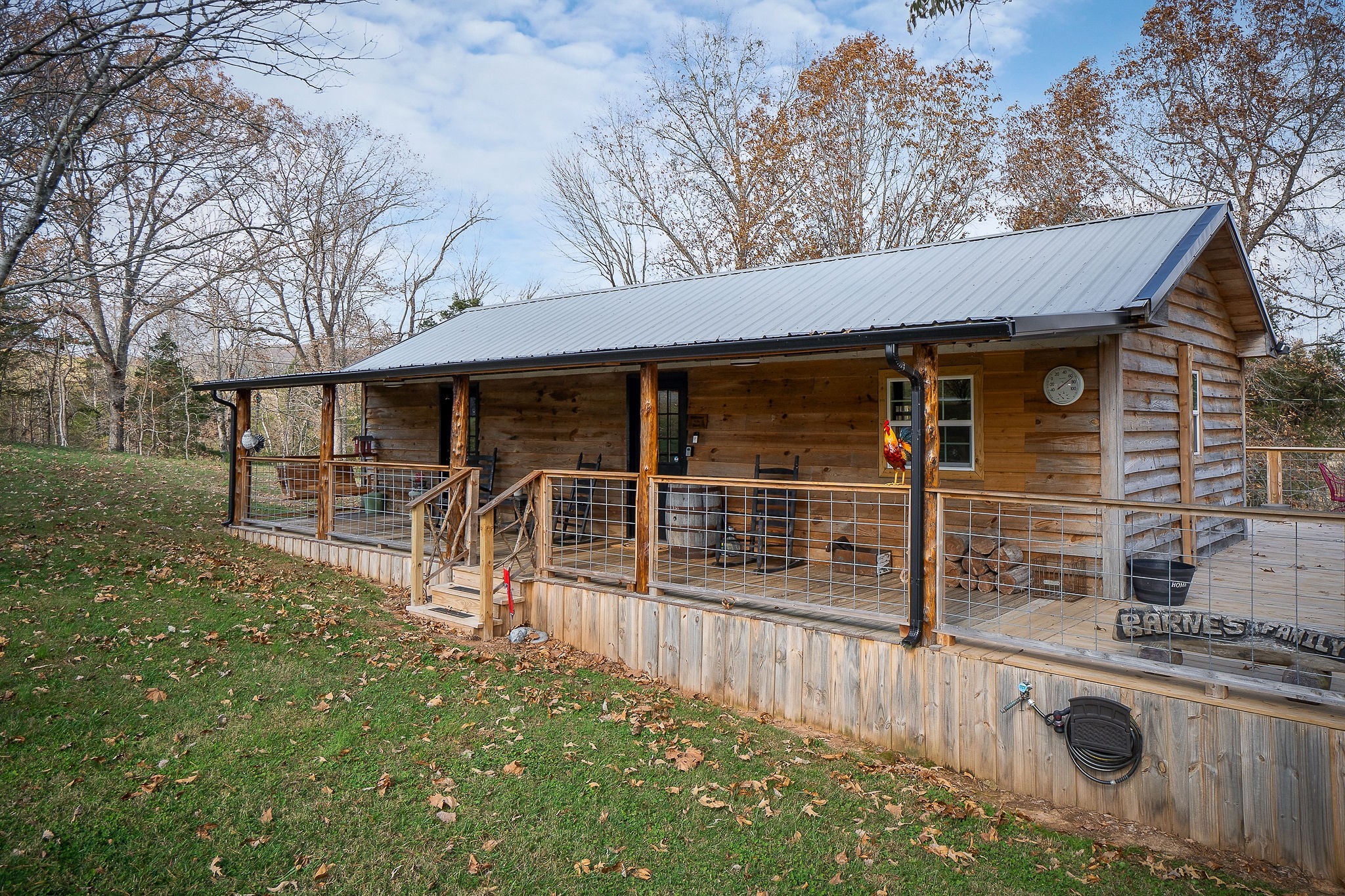 a view of a house with backyard and porch