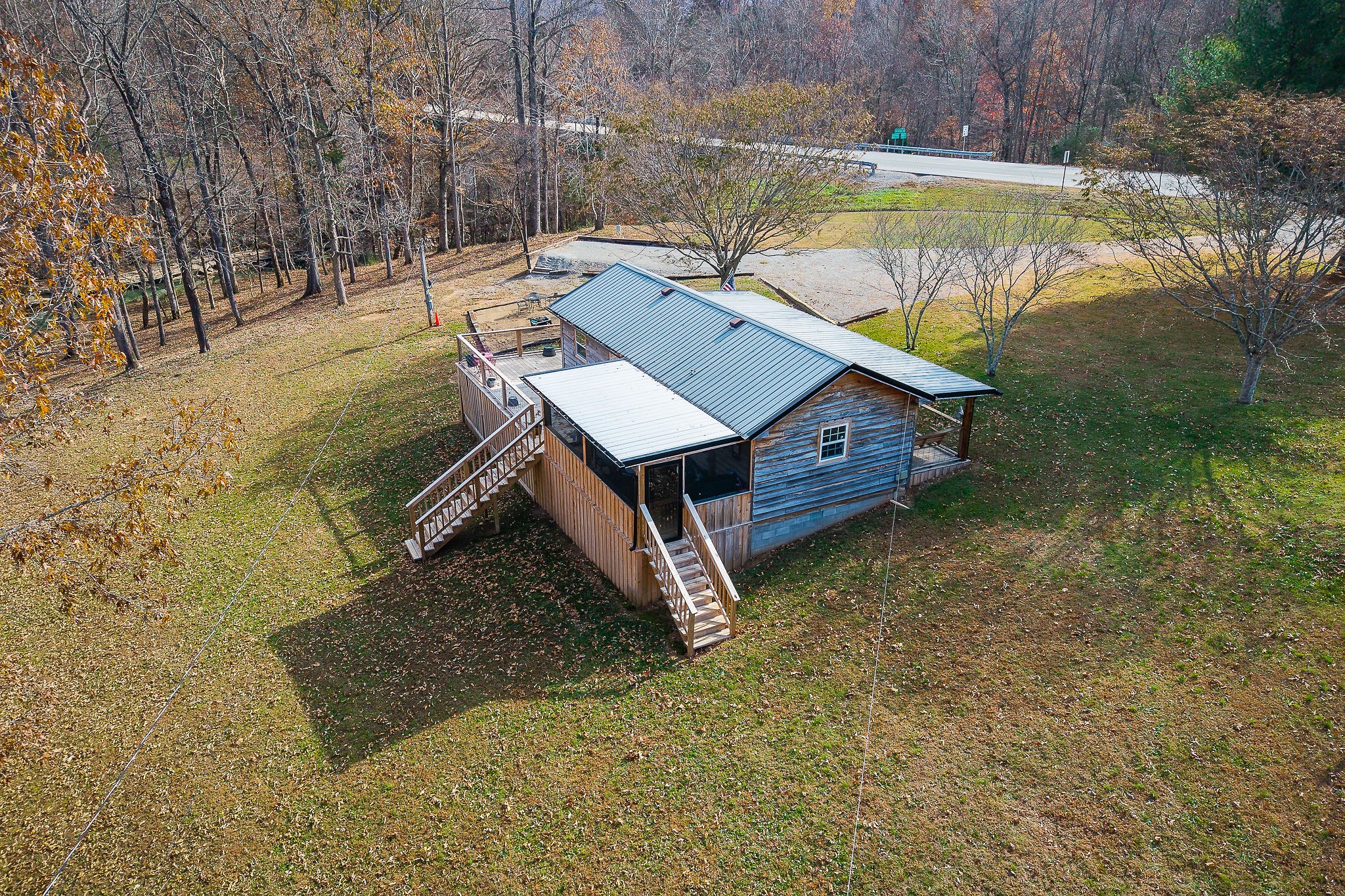 6777 Spencer Road Rock Island, TN 38581 - Photo 16 of 49 a view of a wooden deck with a yard