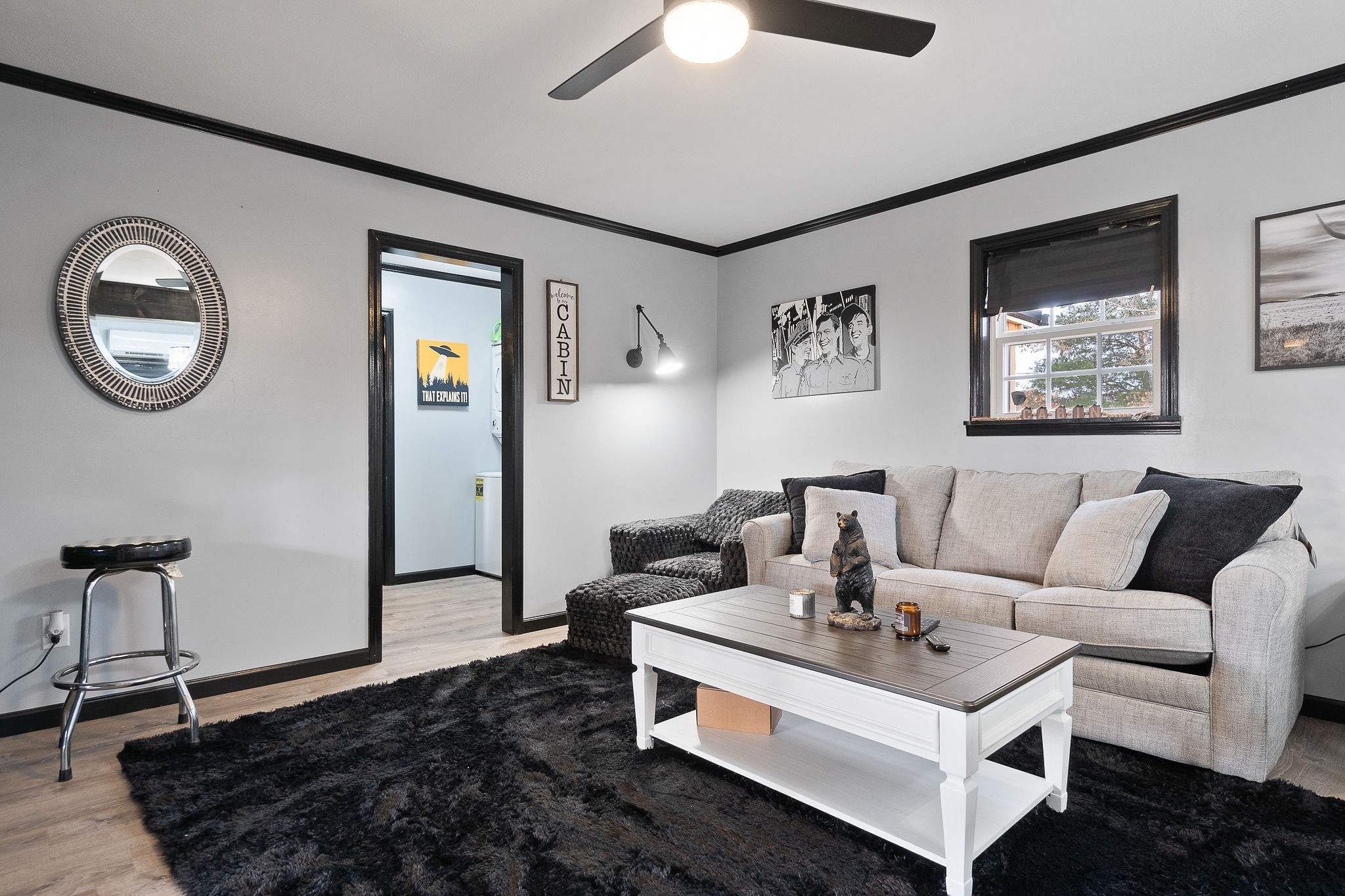 6777 Spencer Road Rock Island, TN 38581 - Photo 20 of 49 a living room with furniture a window and a chandelier