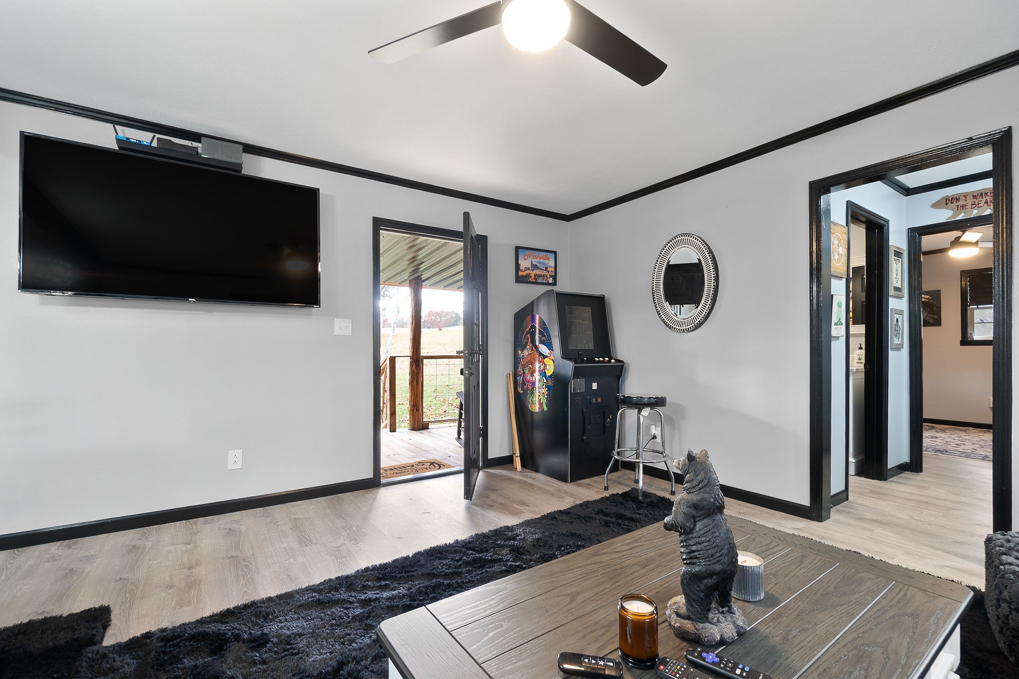 6777 Spencer Road Rock Island, TN 38581 - Photo 21 of 49 a living room with furniture and a flat screen tv