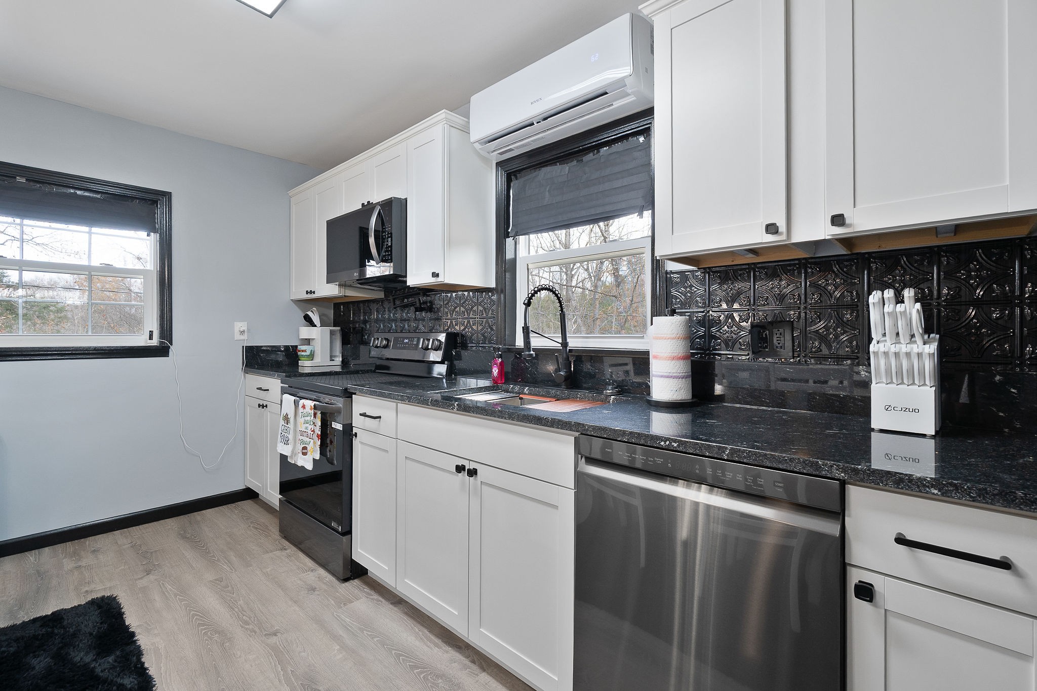 6777 Spencer Road Rock Island, TN 38581 - Photo 23 of 49 a kitchen with stainless steel appliances granite countertop a stove a sink and a microwave