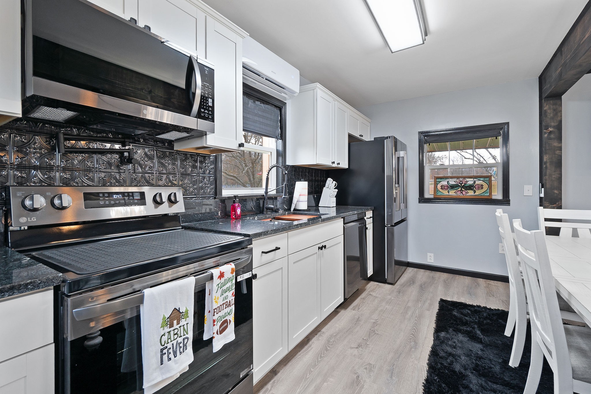 6777 Spencer Road Rock Island, TN 38581 - Photo 24 of 49 a kitchen with stainless steel appliances granite countertop a stove and a sink