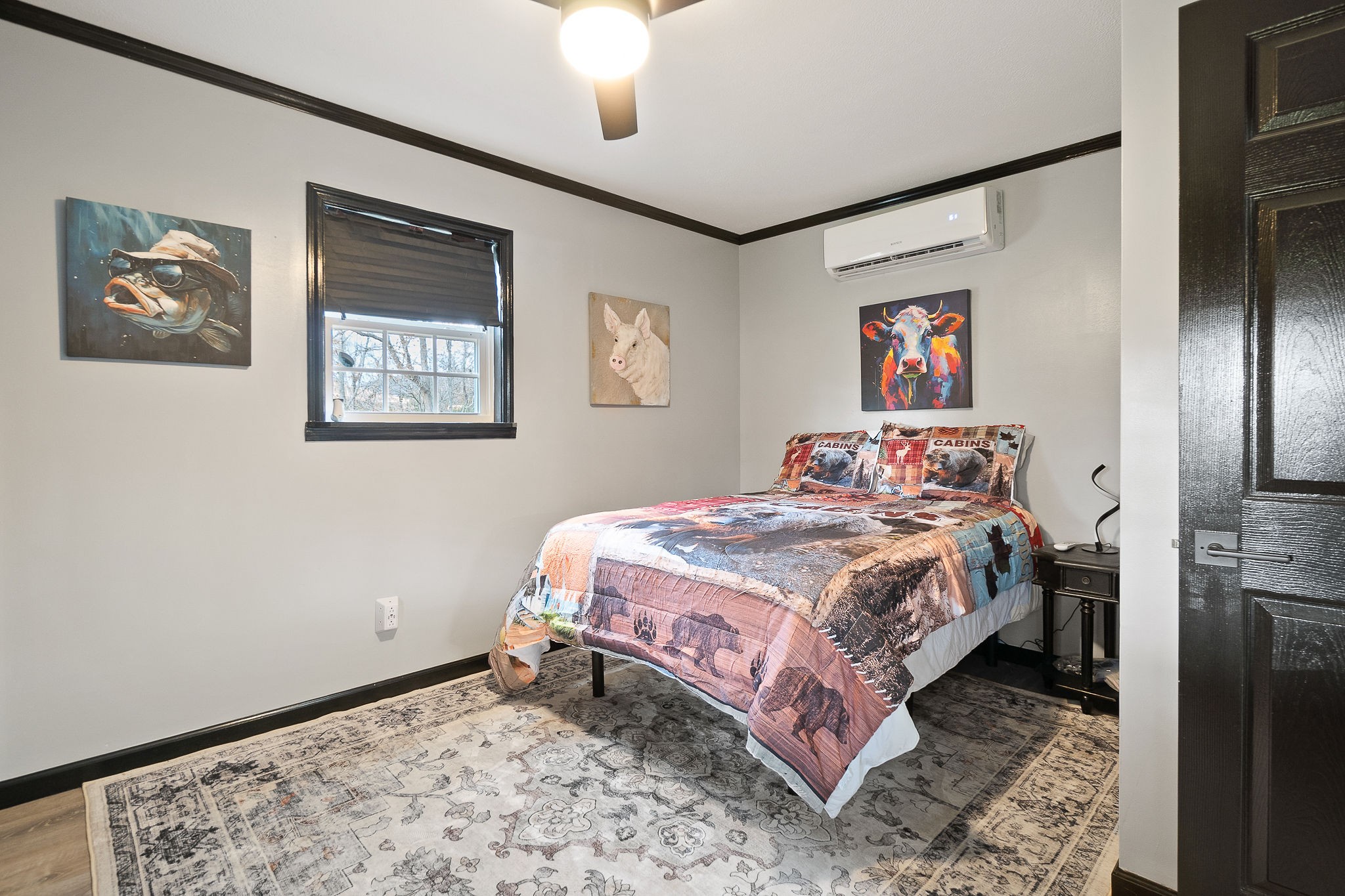 6777 Spencer Road Rock Island, TN 38581 - Photo 28 of 49 a bedroom with a bed and a painting on the wall