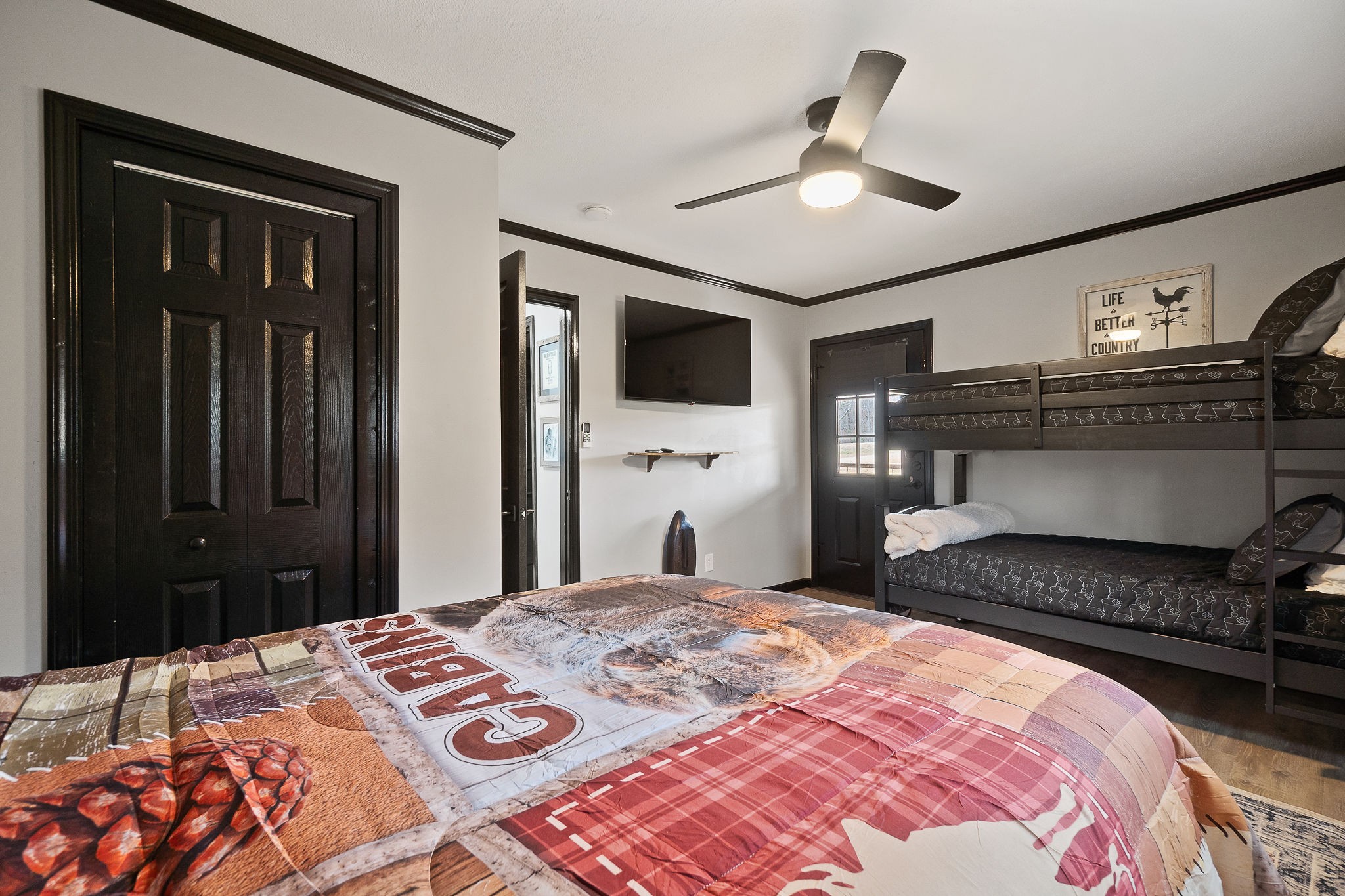 6777 Spencer Road Rock Island, TN 38581 - Photo 29 of 49 a bedroom with a bed and a chandelier