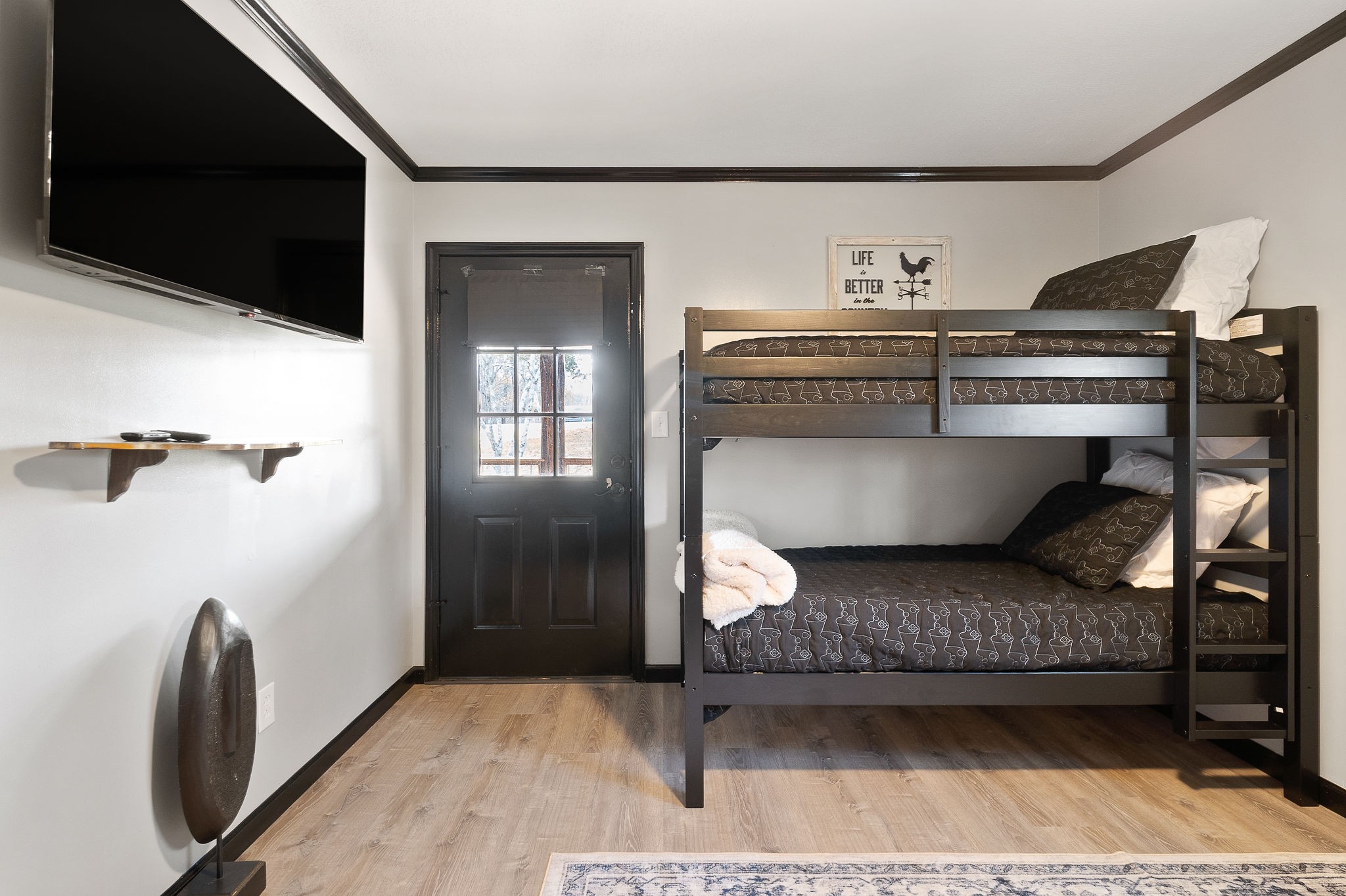 6777 Spencer Road Rock Island, TN 38581 - Photo 30 of 49 a living room with a couch and a flat screen tv