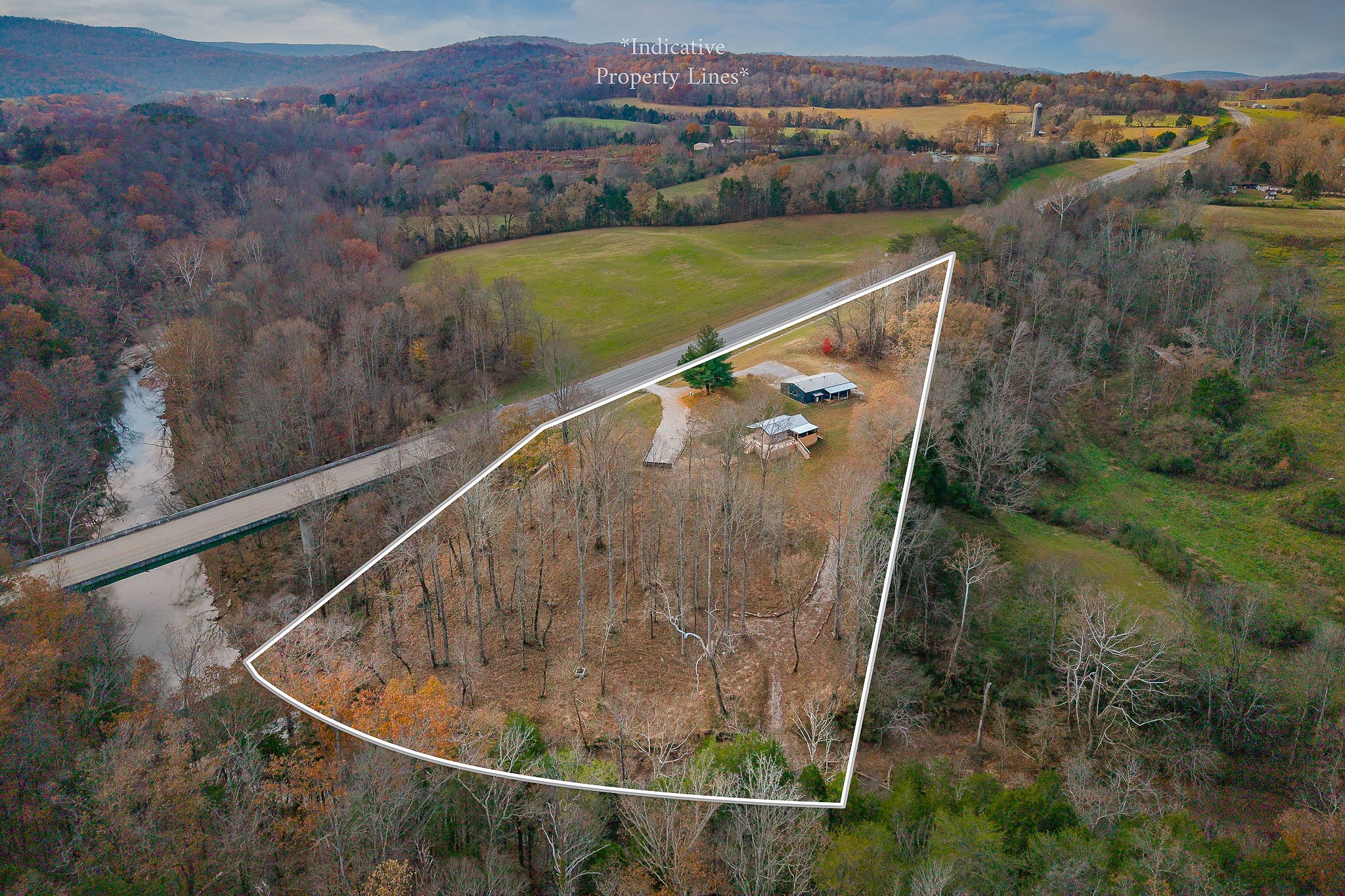 6777 Spencer Road Rock Island, TN 38581 - Photo 3 of 49 an aerial view of a house with a yard