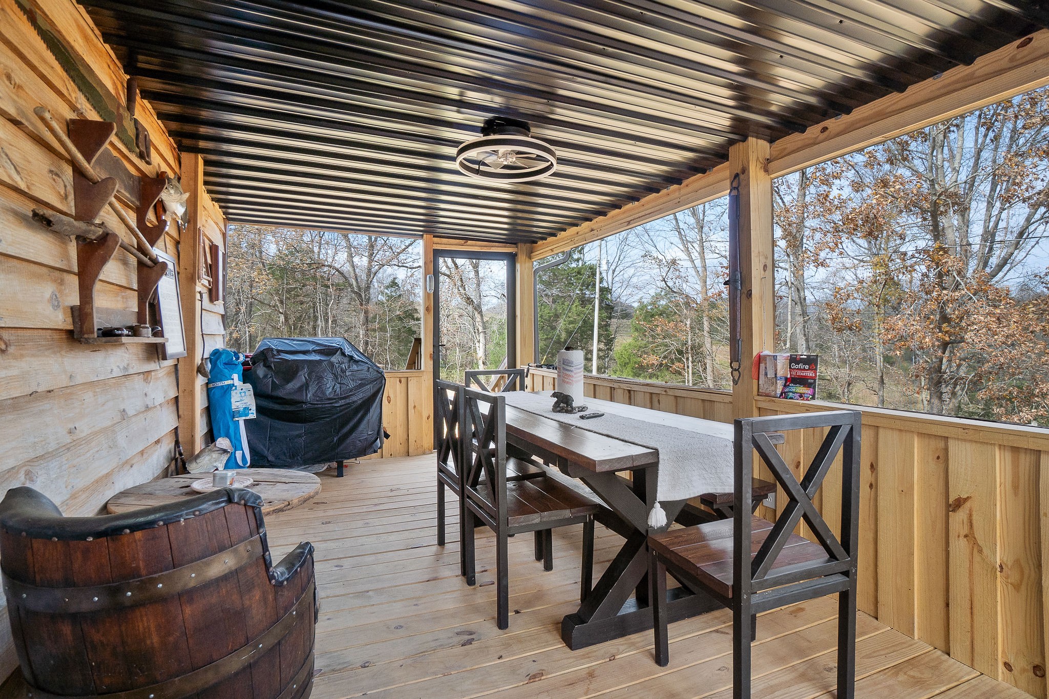 6777 Spencer Road Rock Island, TN 38581 - Photo 35 of 49 a view of an outdoor sitting area with couch and wooden fence