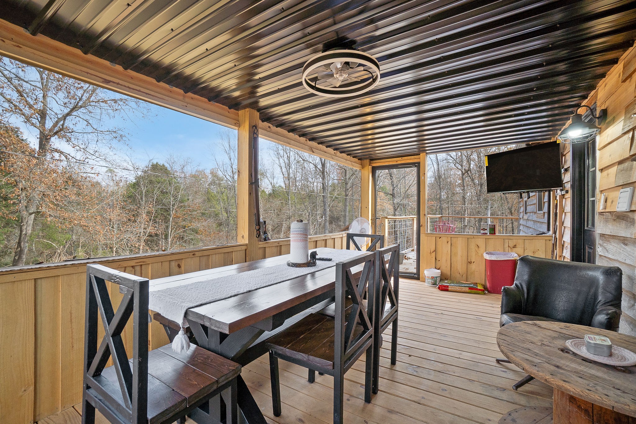 6777 Spencer Road Rock Island, TN 38581 - Photo 36 of 49 a view of a patio with table and chairs and wooden floor
