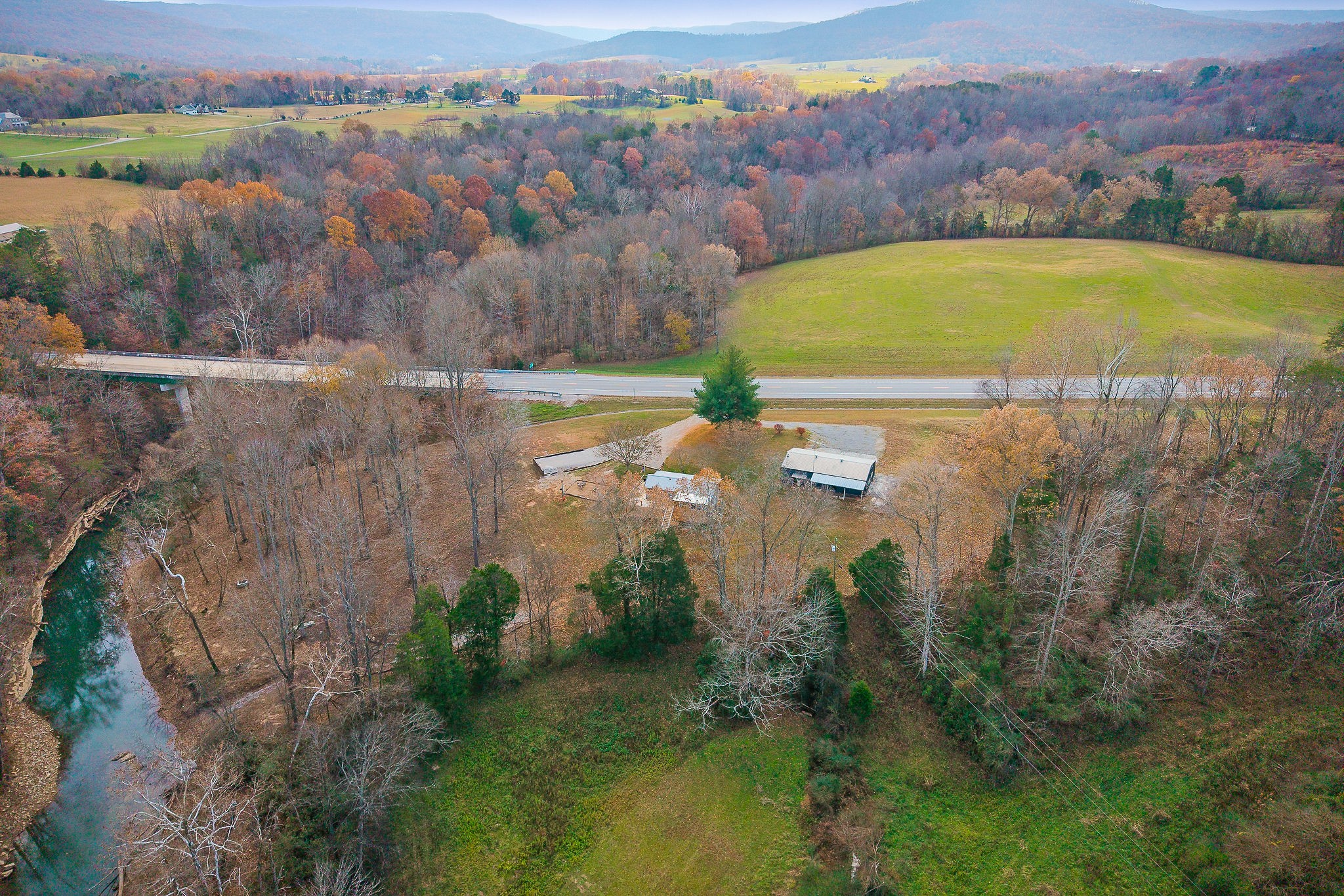 6777 Spencer Road Rock Island, TN 38581 - Photo 10 of 49 an aerial view of residential houses with outdoor space and lake view