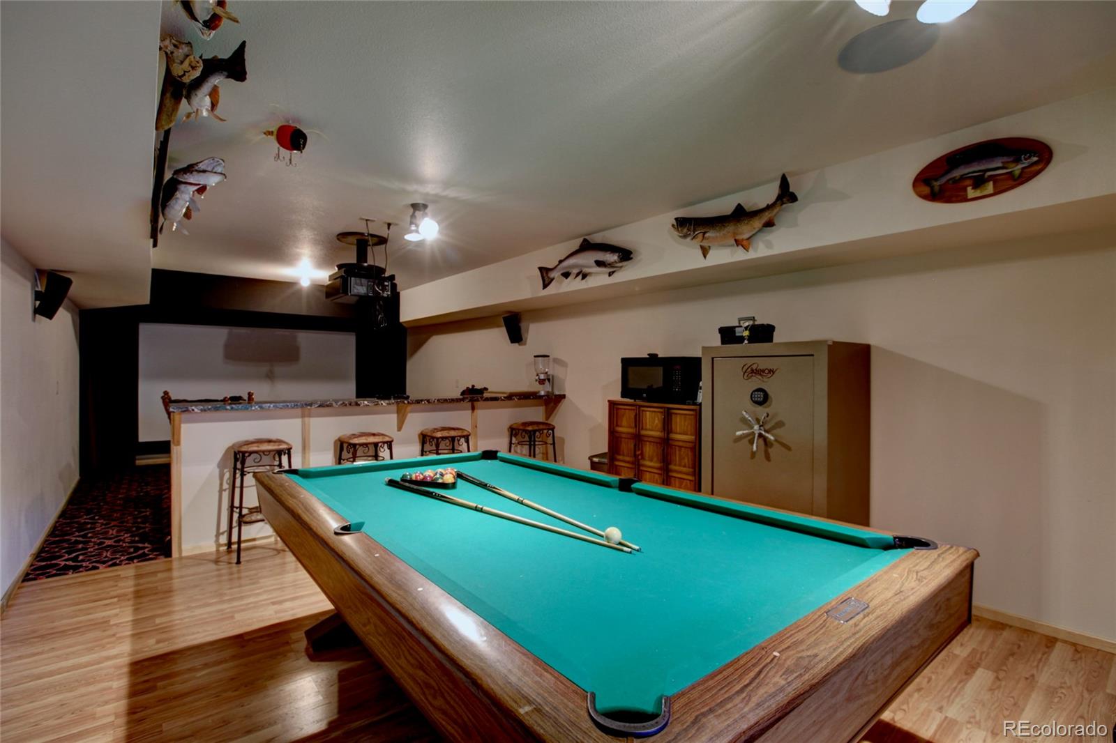 530 Red Feather Road Cotopaxi, CO 81223 - Photo 31 of 46 a room with pool table and a wooden floor