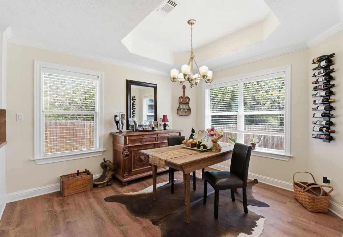 232 North Dixie Street Brenham, TX 77833 - Photo 13 of 41 Bright dining room with hardwood floors, large windows offer ample natural light.