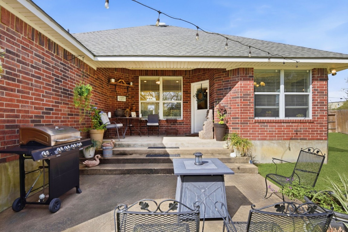 232 North Dixie Street Brenham, TX 77833 - Photo 36 of 41 This inviting backyard features a cozy patio, perfect for outdoor gatherings. The brick exterior and well-kept lawn add charm and warmth.