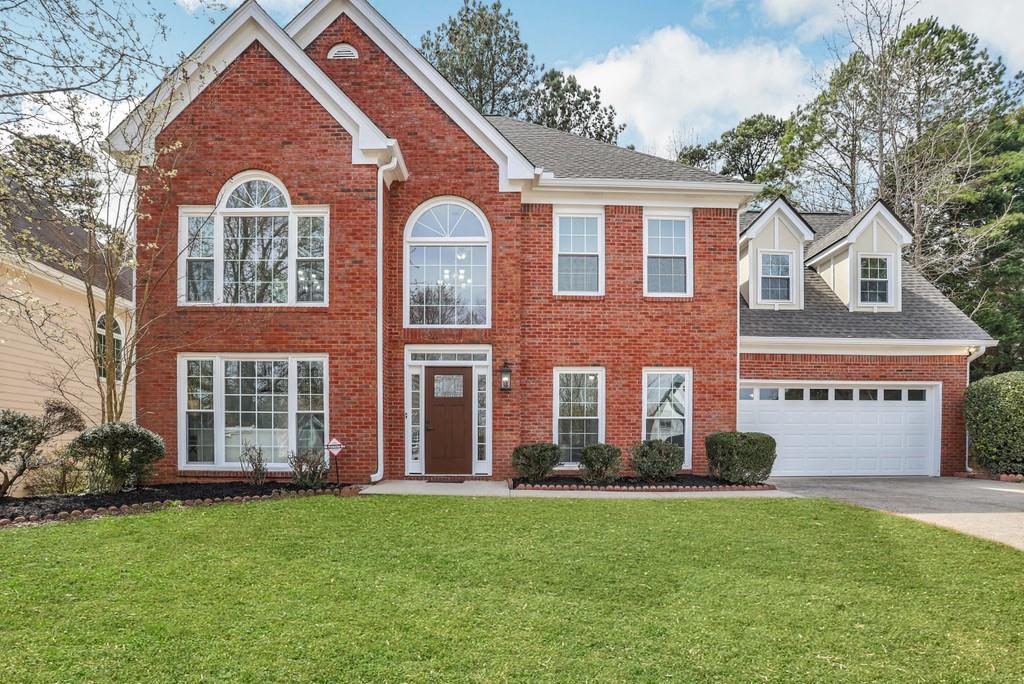 front view of a house with a yard